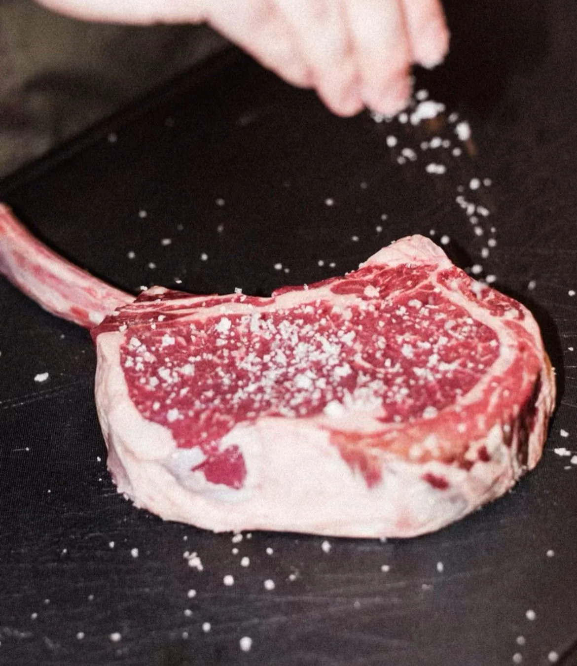 Geometric drawing of an outline square with sections divided by vertical, horizontal, and diagonal lines.