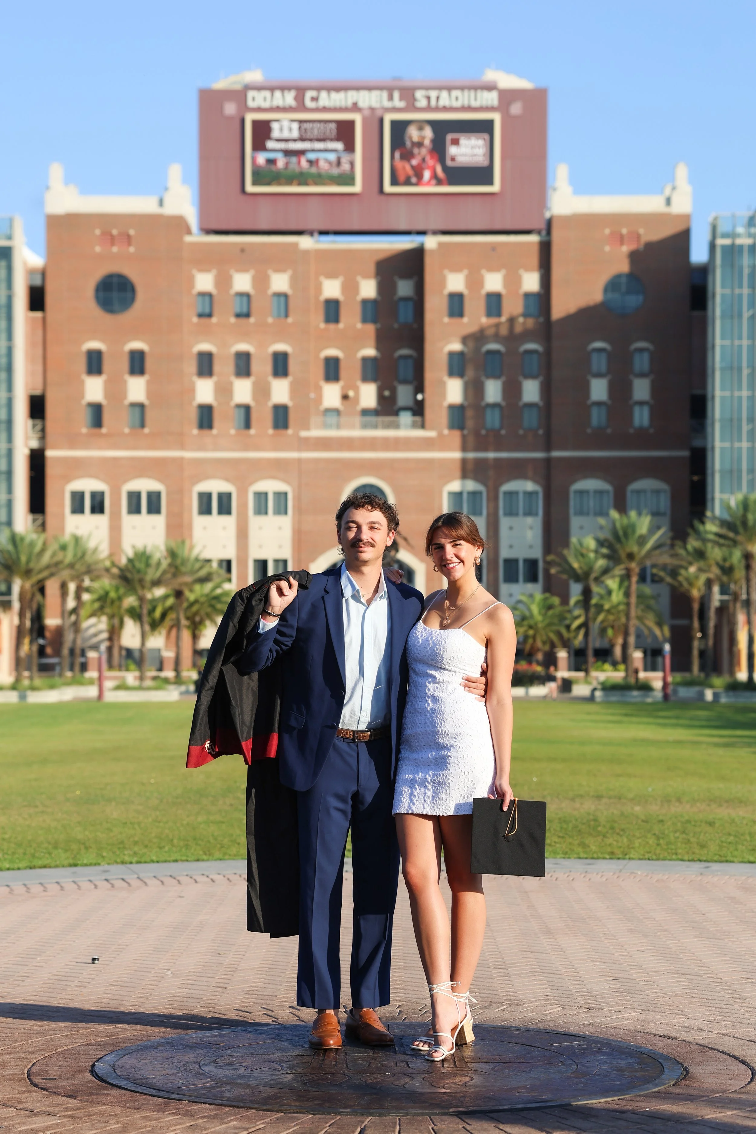 'DOAK CAMPBELL STADIUM' at Florida State University Graduation Photos for a young couple.