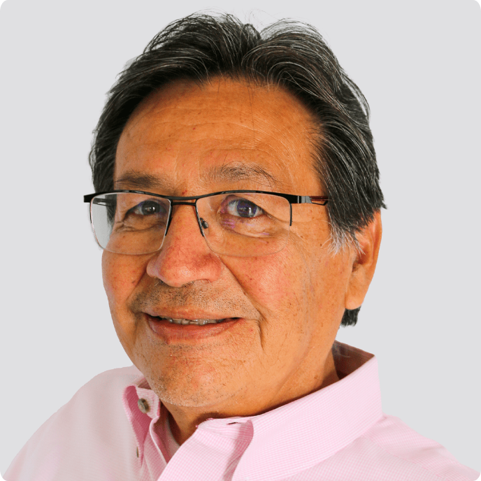 Rick Waters, Treasurer, smiling older man with glasses in a light pink shirt.