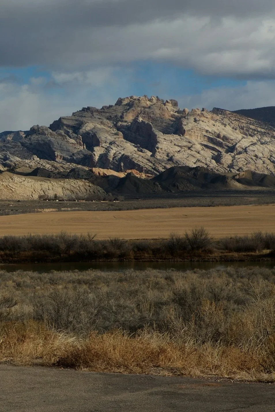 View of Dinosaur National Monument with rock formations and desert landscape.
