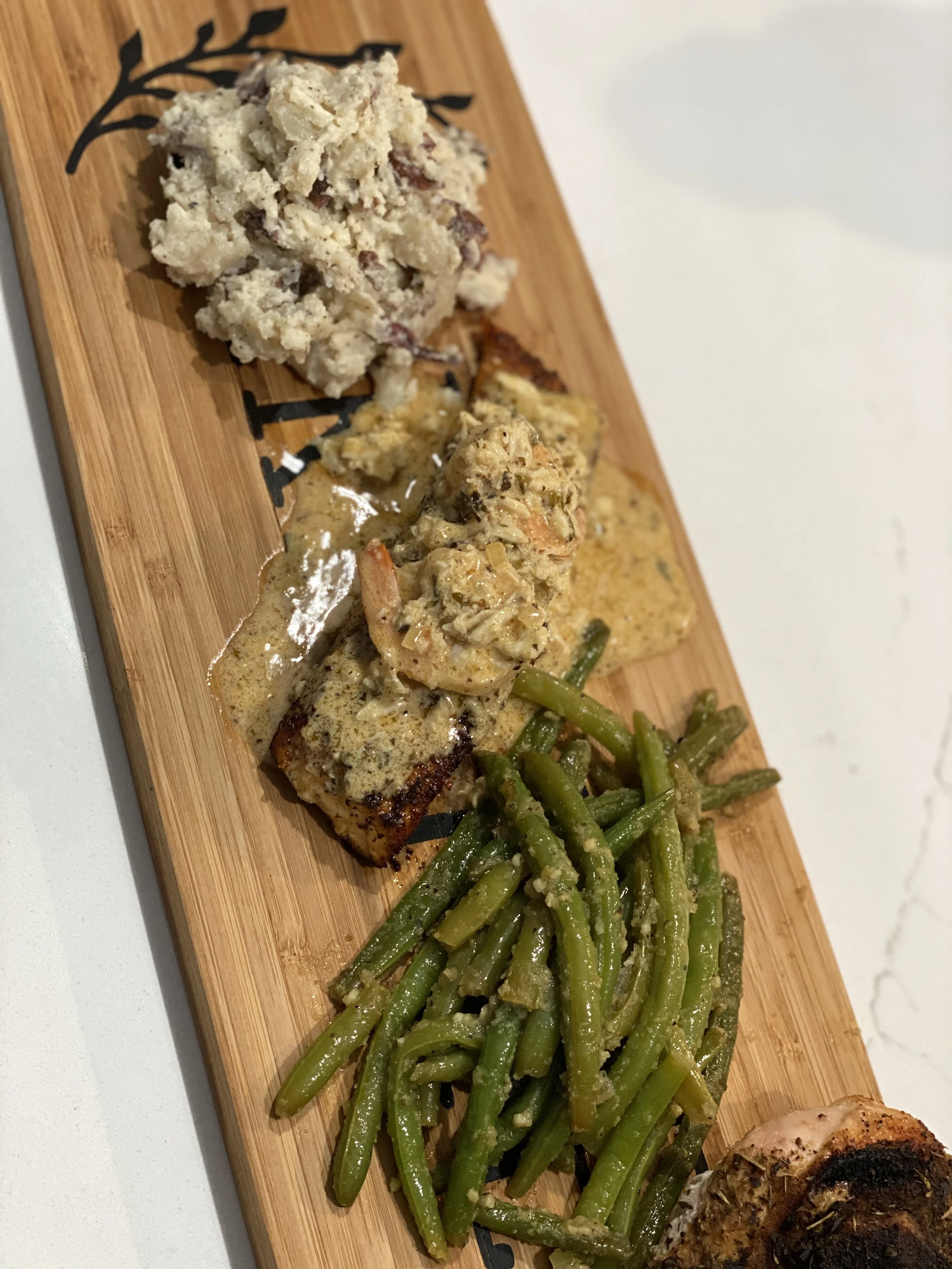 Blackened Salmon topped  with Shrimp in a creamy sauce, Whole Green Beans & Redskin Smashed Potatoes