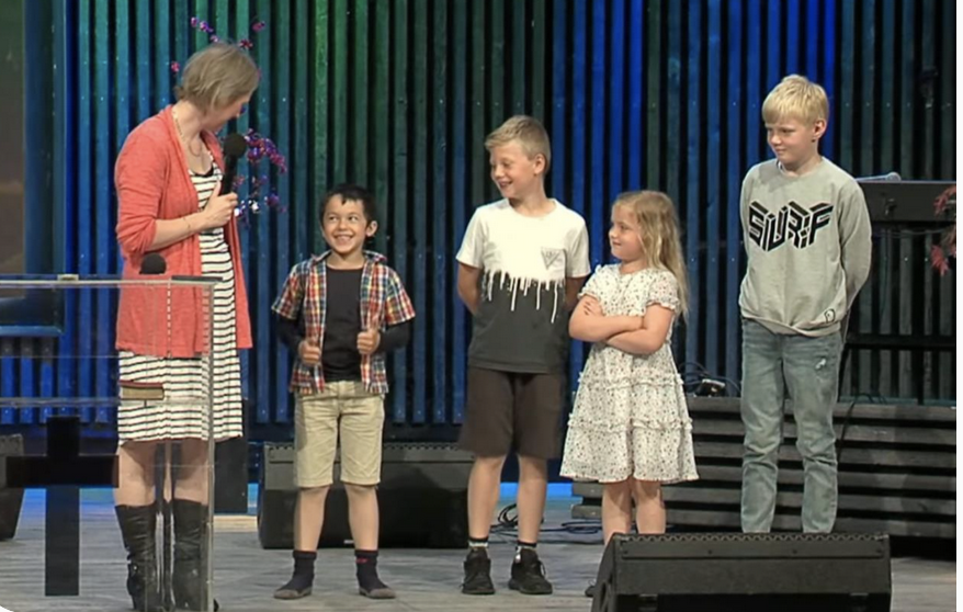 Pastor Hilde Tokheim Phen preaching and teaching for children.