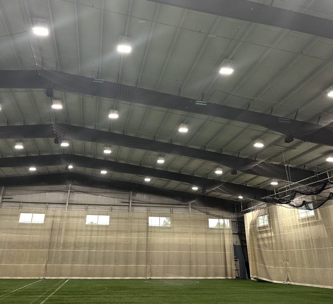 Indoor baseball, softball, soccer, sports facility with turf and netting
