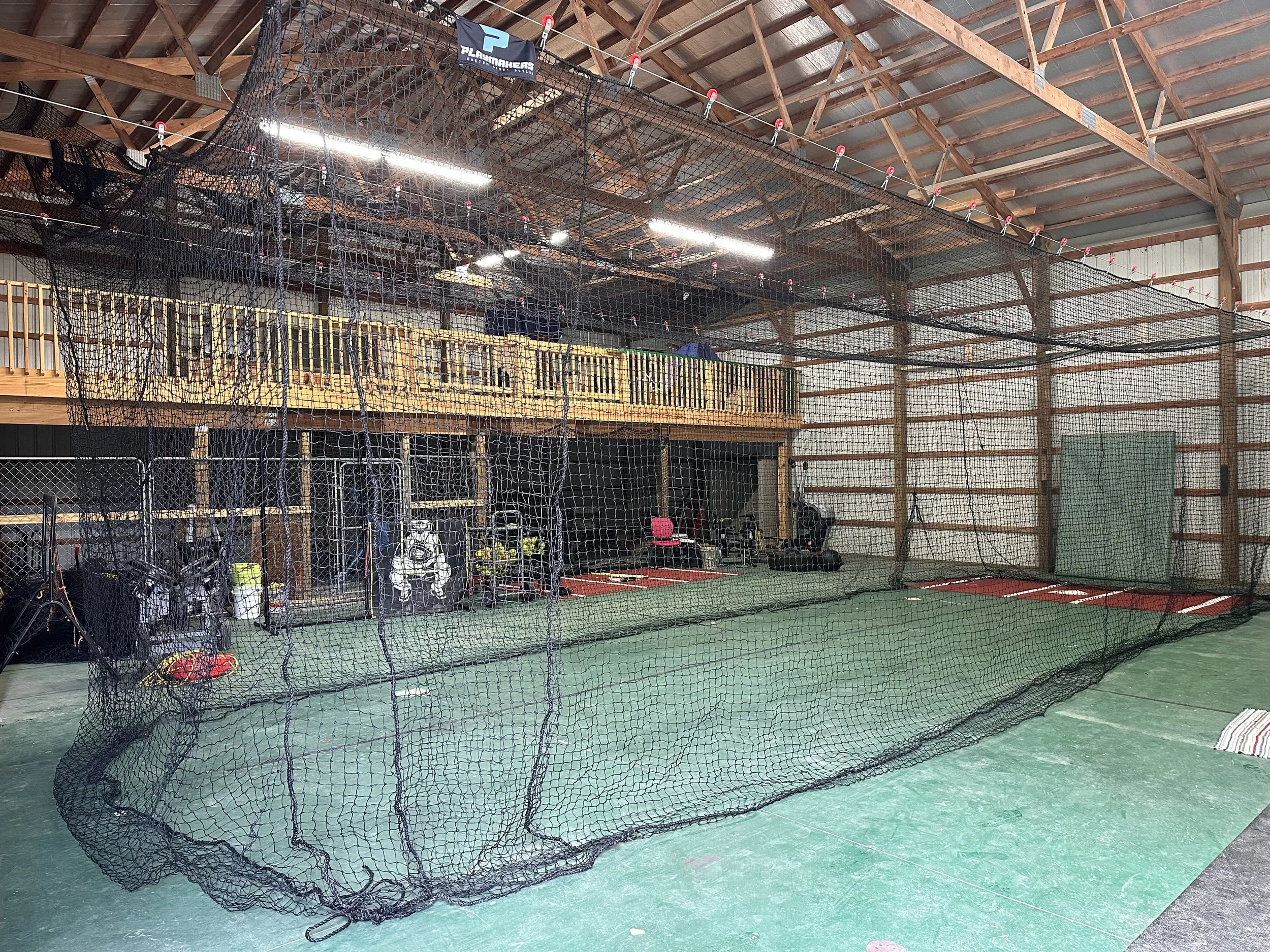 Indoor batting cage in a barn garage