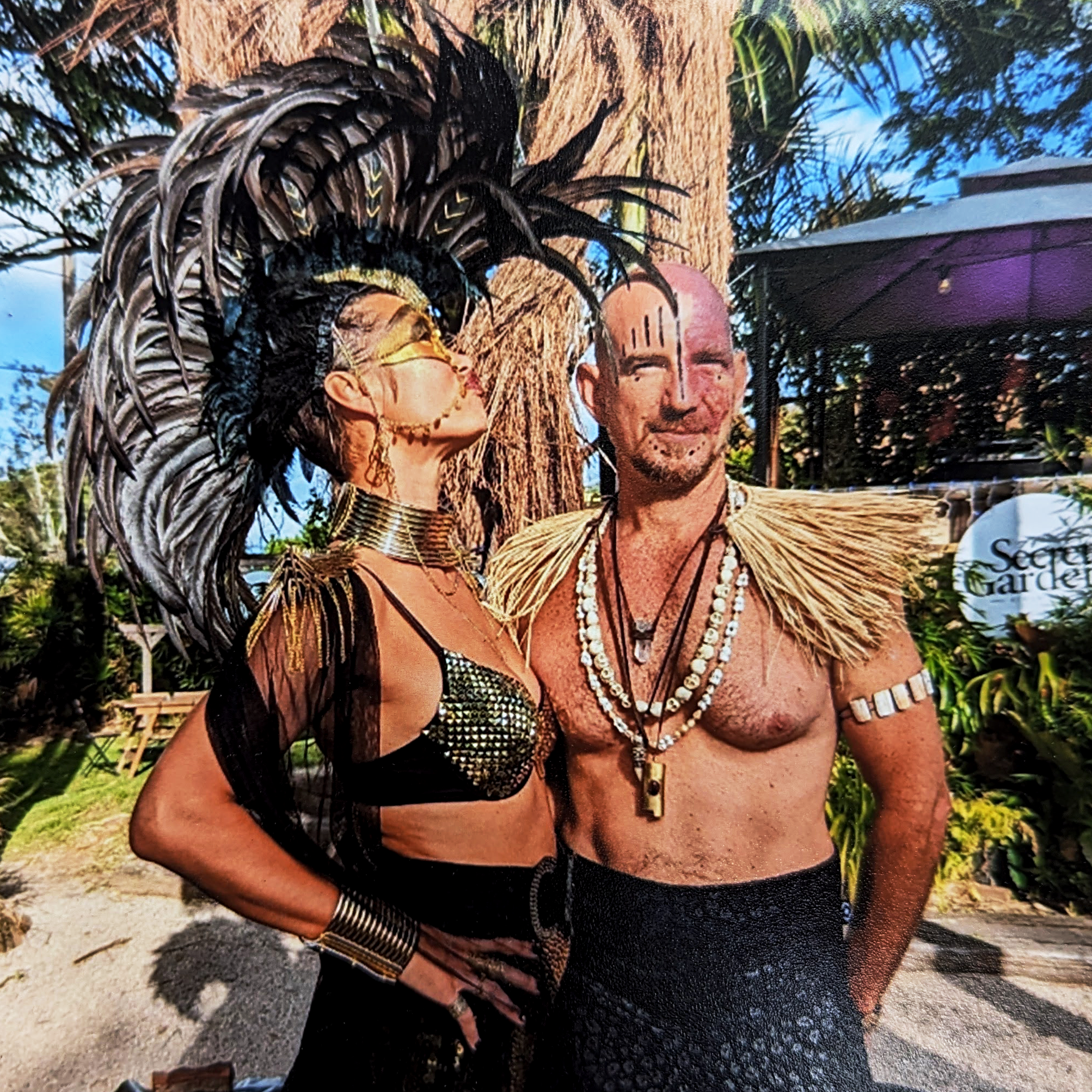 Kris Nolan and Roxy dressed in elaborate costumes at a Burning Man–themed party.