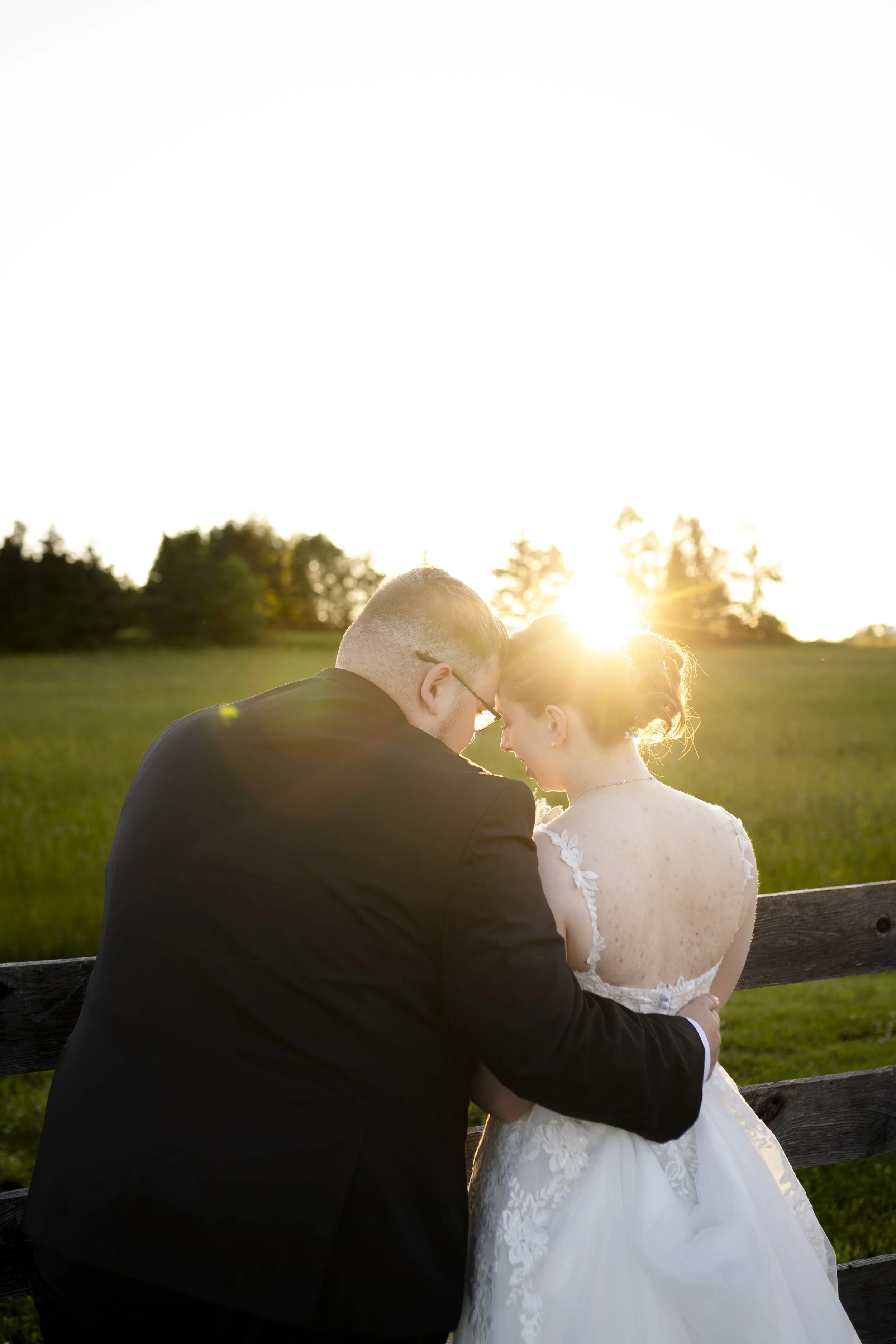 Matt and Miranda get married at Rustic Ties with the sun setting to the front of them