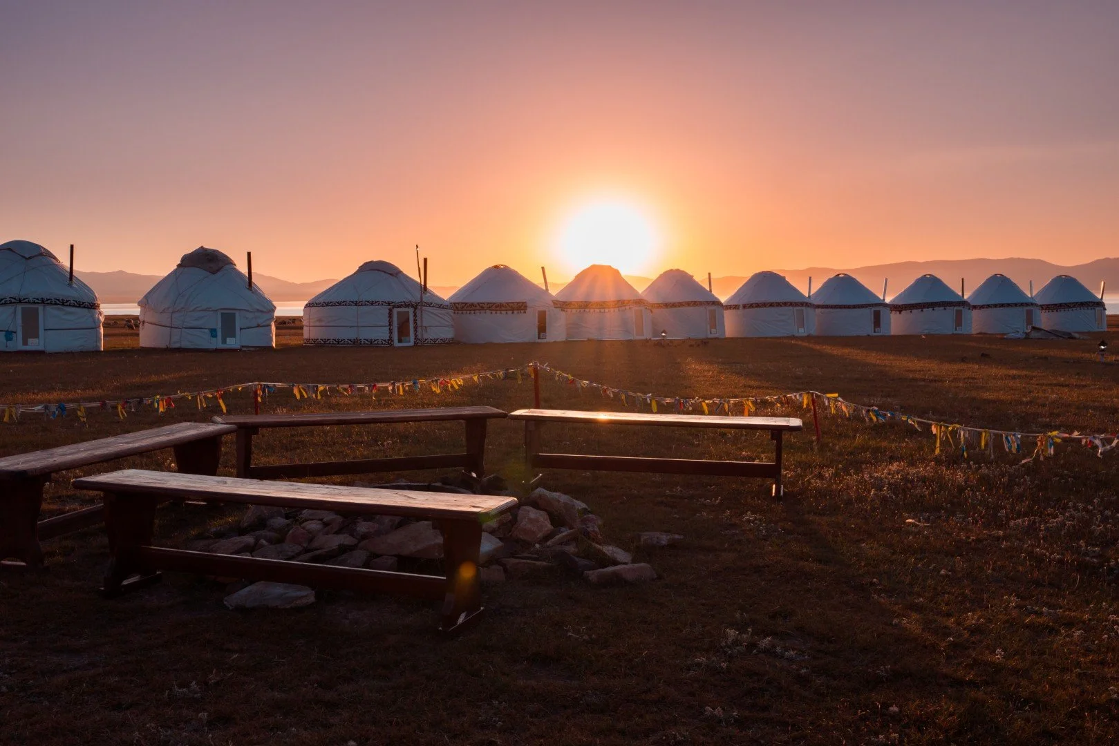 Song-Kol yurt camp sunset visited by guests of apricot adventures during the slow travel tour experience kyrgyzstan unhurried