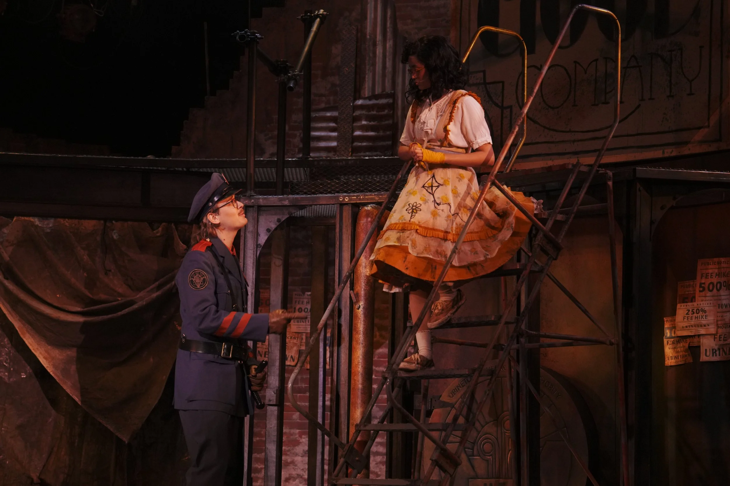 April Plascencia as Little Sally and Luke Stursma as Officer Lockstock in Urinetown at the Nebraska Repertory Theatre (2025)