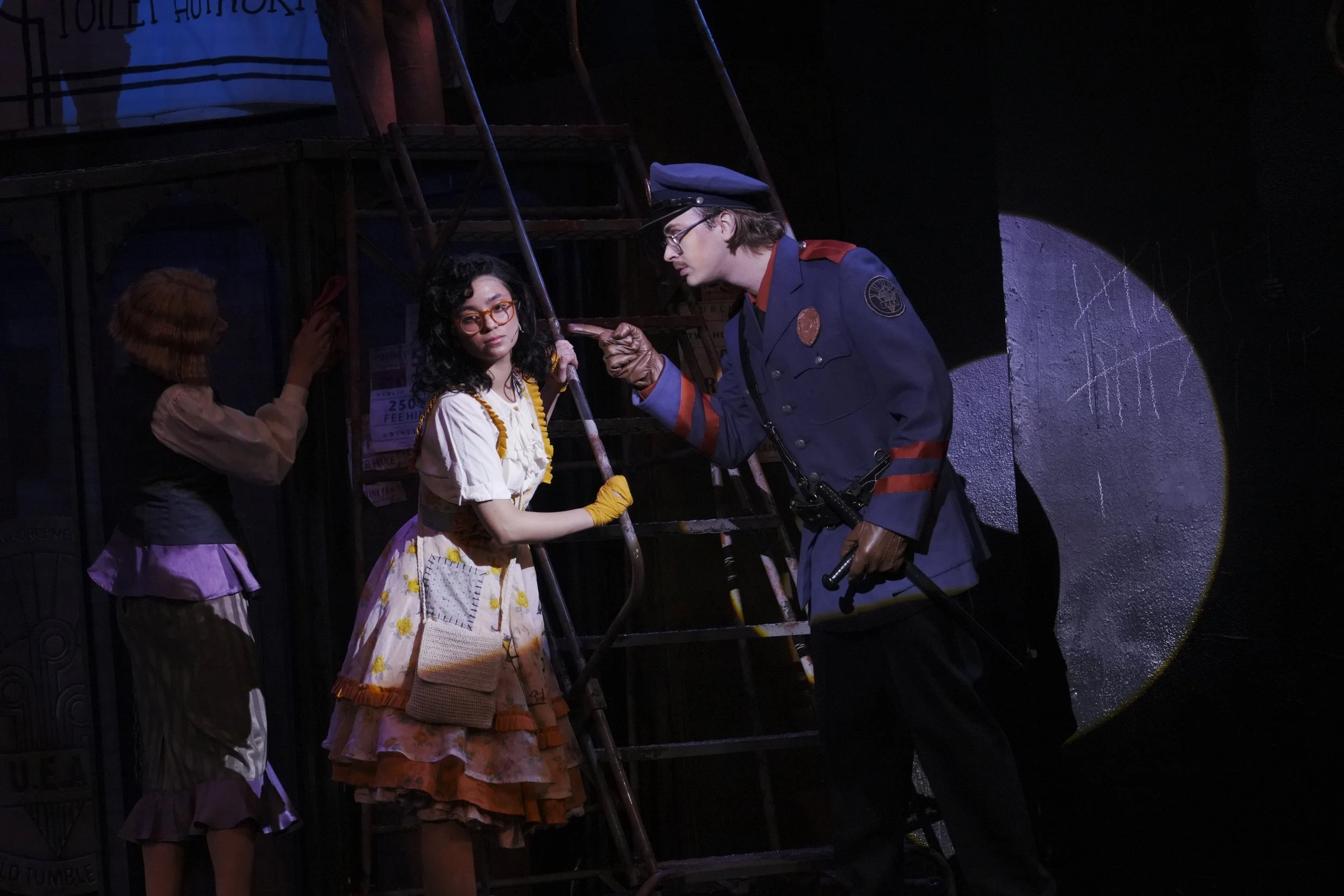 April Plascencia as Little Sally and Luke Stursma as Officer Lockstock in Urinetown at the Nebraska Repertory Theatre (2025)
