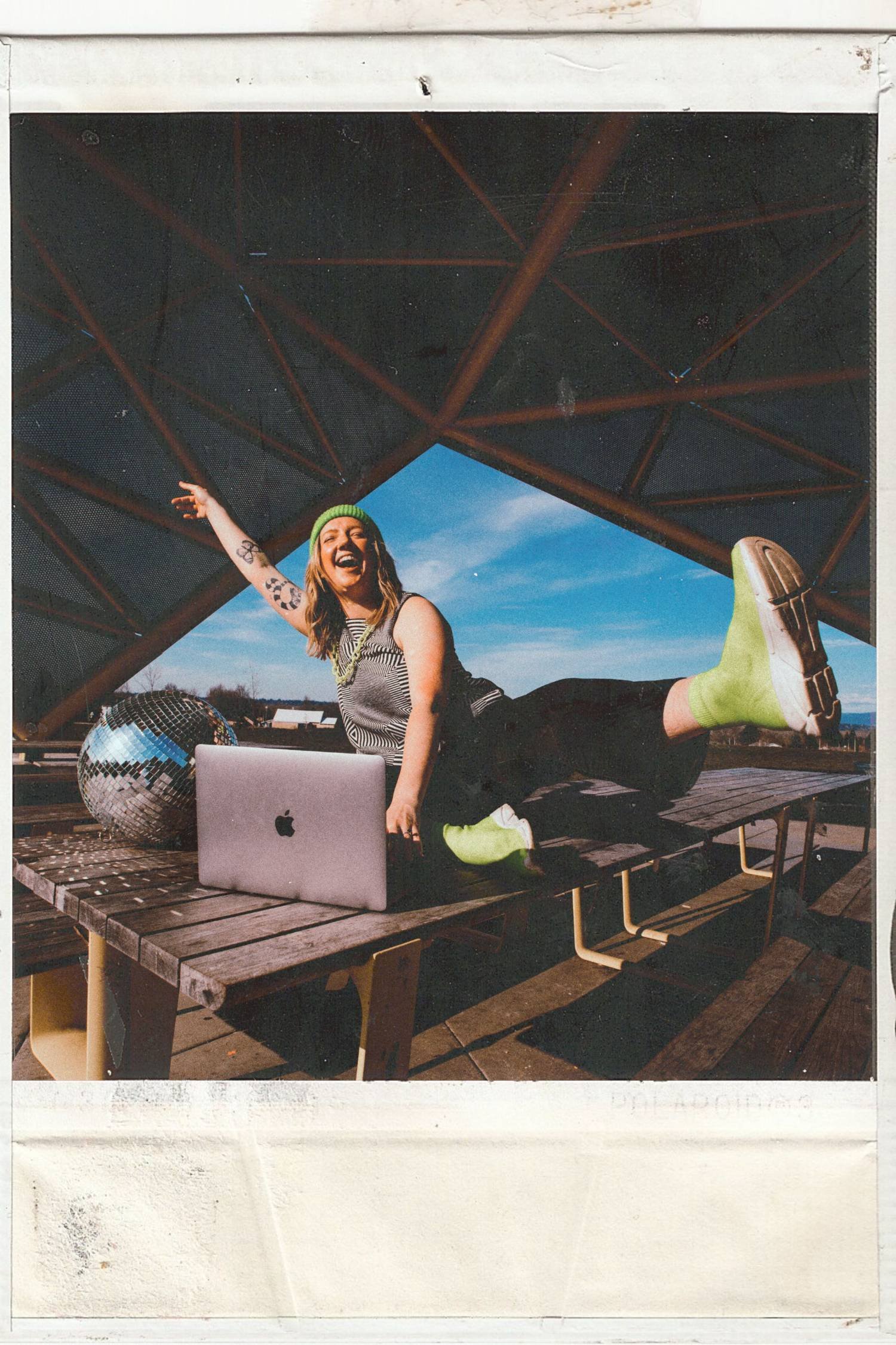polaroid of woman exited to be web designer and making money building cool websites