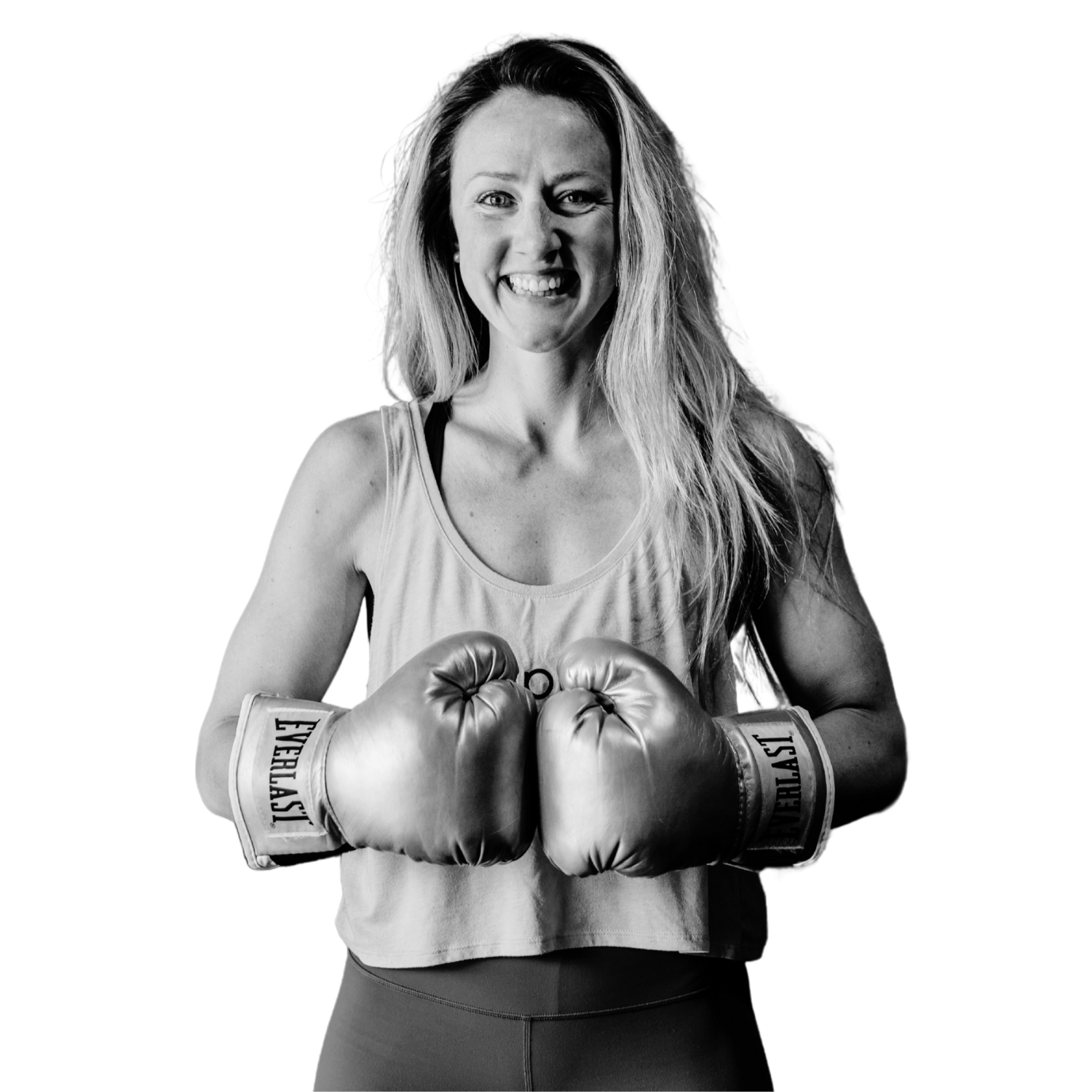 Fitness and Breathwork educator Shantell Dayton wearing boxing gloves and smiling.