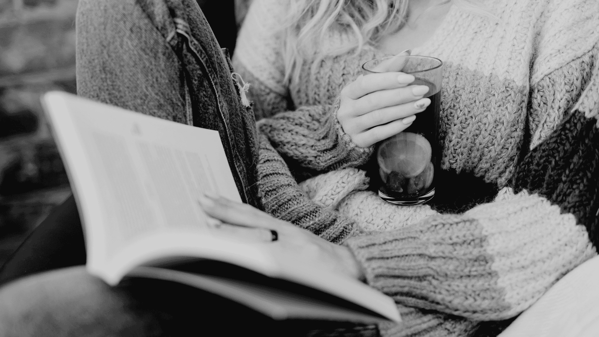 Woman reading outdoors in nature during Lüsha Method Gather women's book club