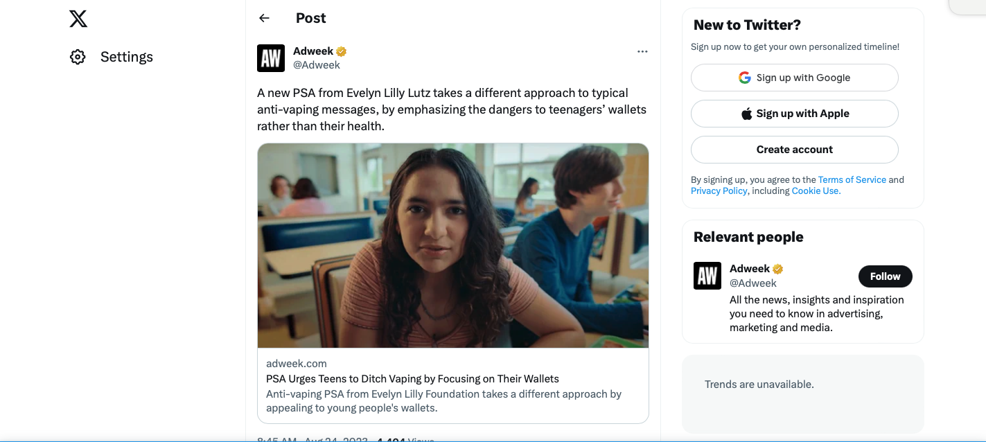 A social media post from Adweek showing a young woman with long brown hair in a classroom setting, looking at the camera, with students seated in the background.