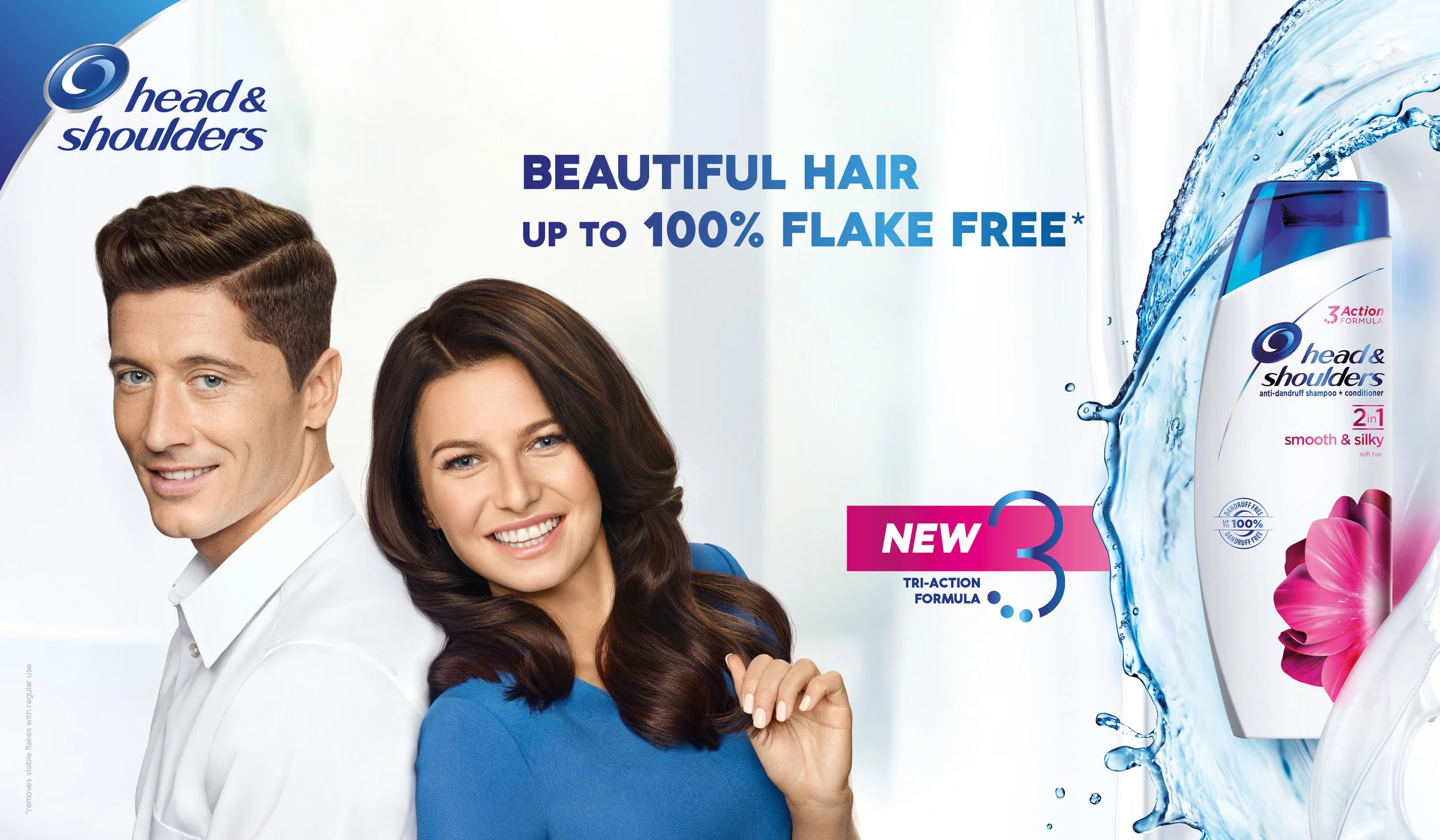 Advertisement for Head & Shoulders shampoo showing a smiling man with brown hair and a smiling woman with dark brown hair, bottles of Head & Shoulders shampoo amid water splashes, and text highlighting benefits like flake-free hair and a new formula.