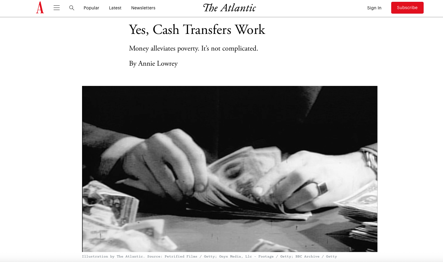 Black and white photo of a person counting paper currency, hands visible with some rings, spread of money on a table.