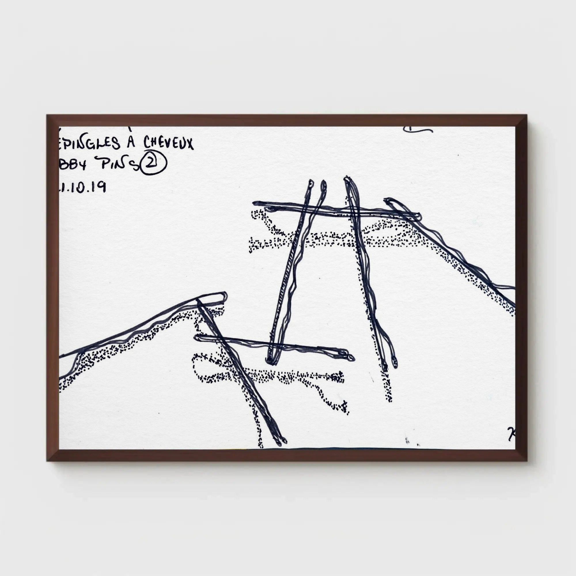 lose-up of framed ink drawing "Épingles à Cheveux No. 2" by Glissandre Bryant, mounted on a plain wall
