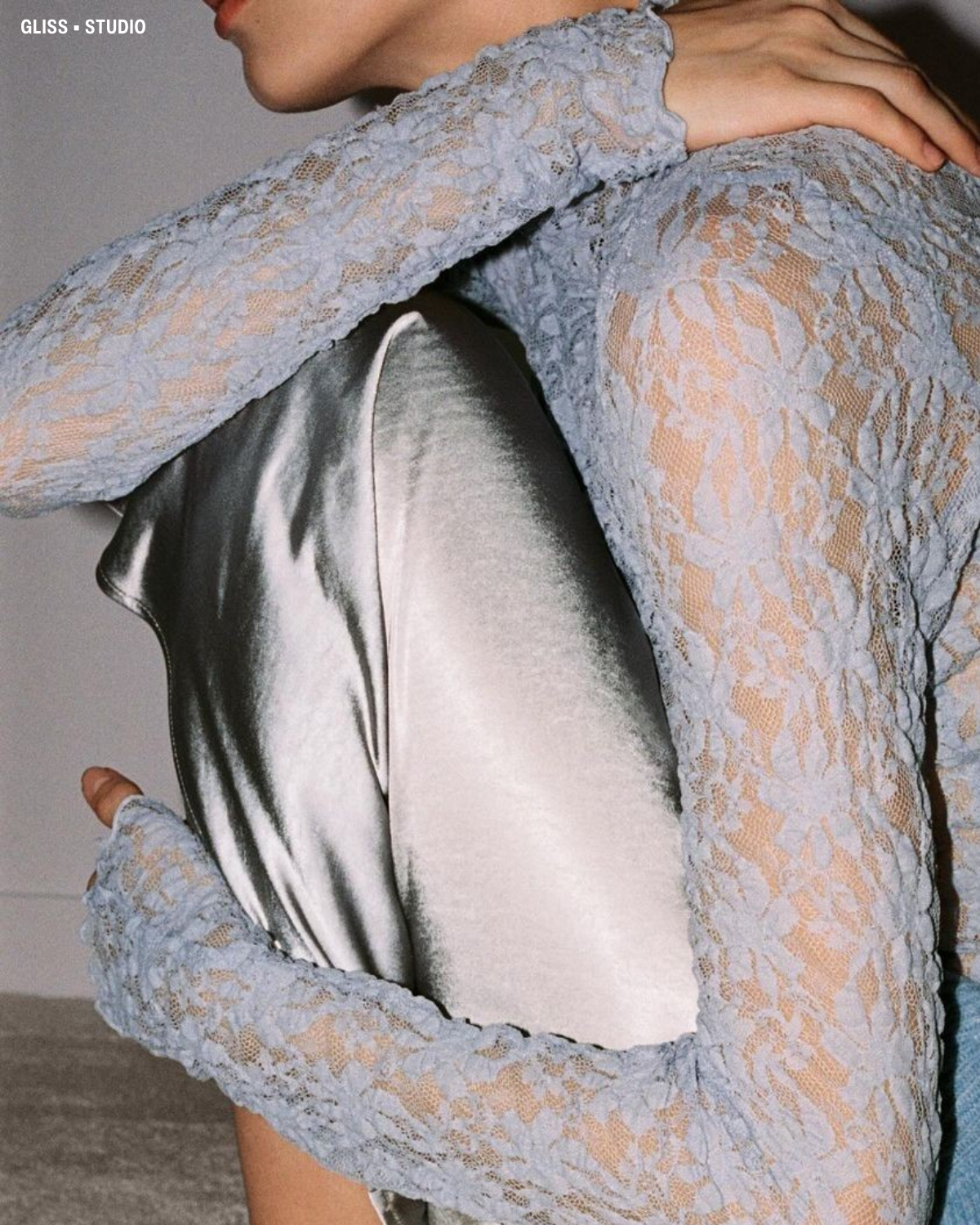 Muted blue floral sheer lace top and silver satin midi skirt.