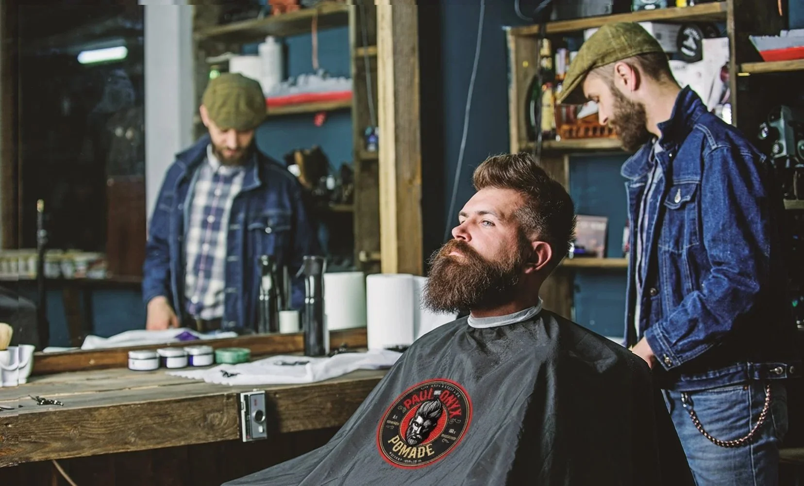 Barber using Paul Onyx hair pomade on a client