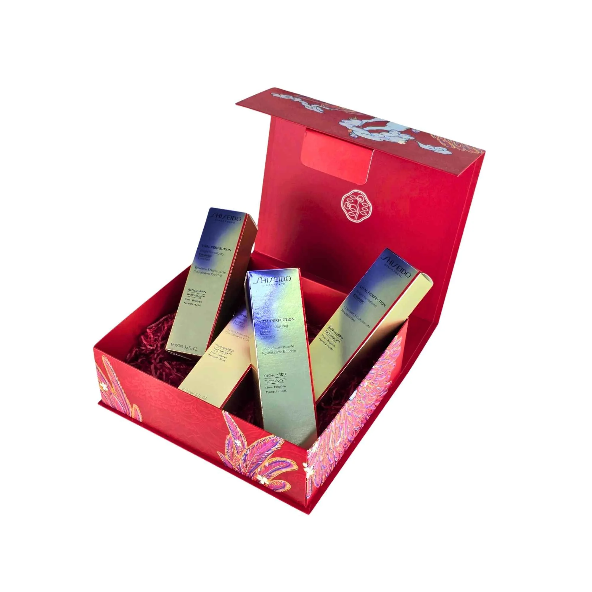 Open red Shiseido collapsible gift box featuring internal branding and holding several custom packaging boxes inside.