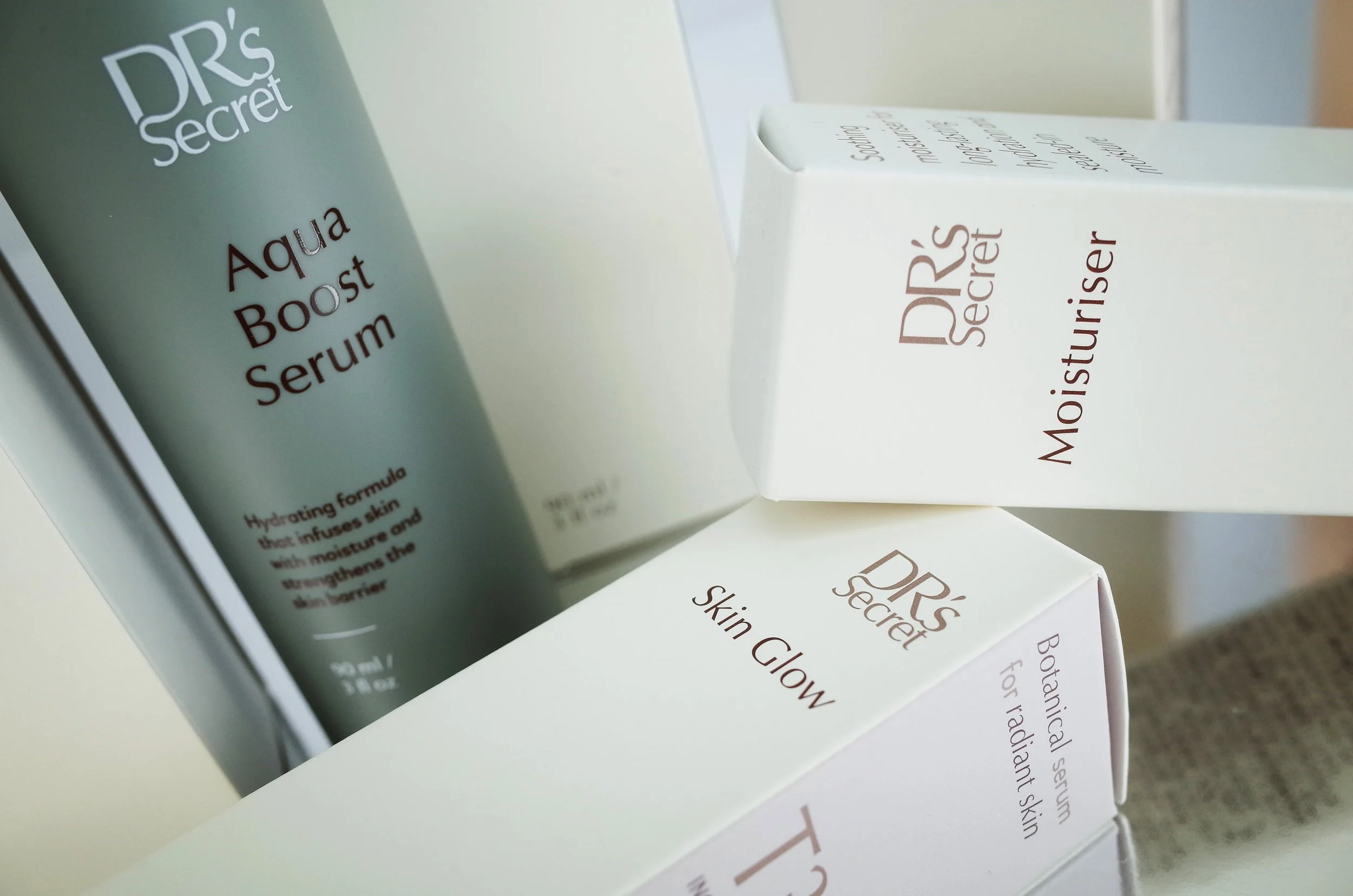 DR’s Secret skincare packaging boxes with minimalist design and printed branding, arranged to show product structure and carton detailing.​