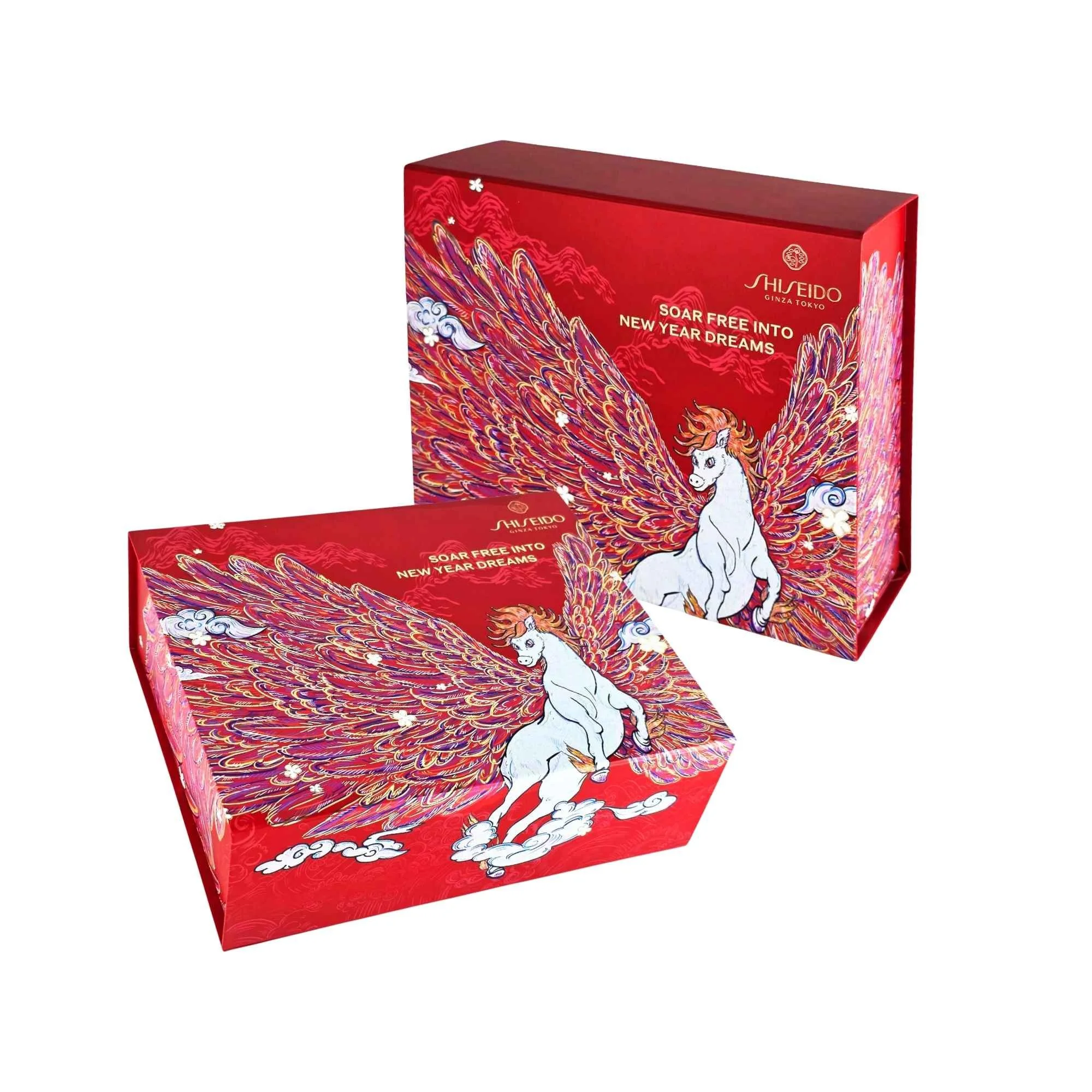 Two red Shiseido Chinese New Year gift boxes displayed together, showcasing the premum box structure, hot-stamped gold elements, and colorful winged horse illustration.