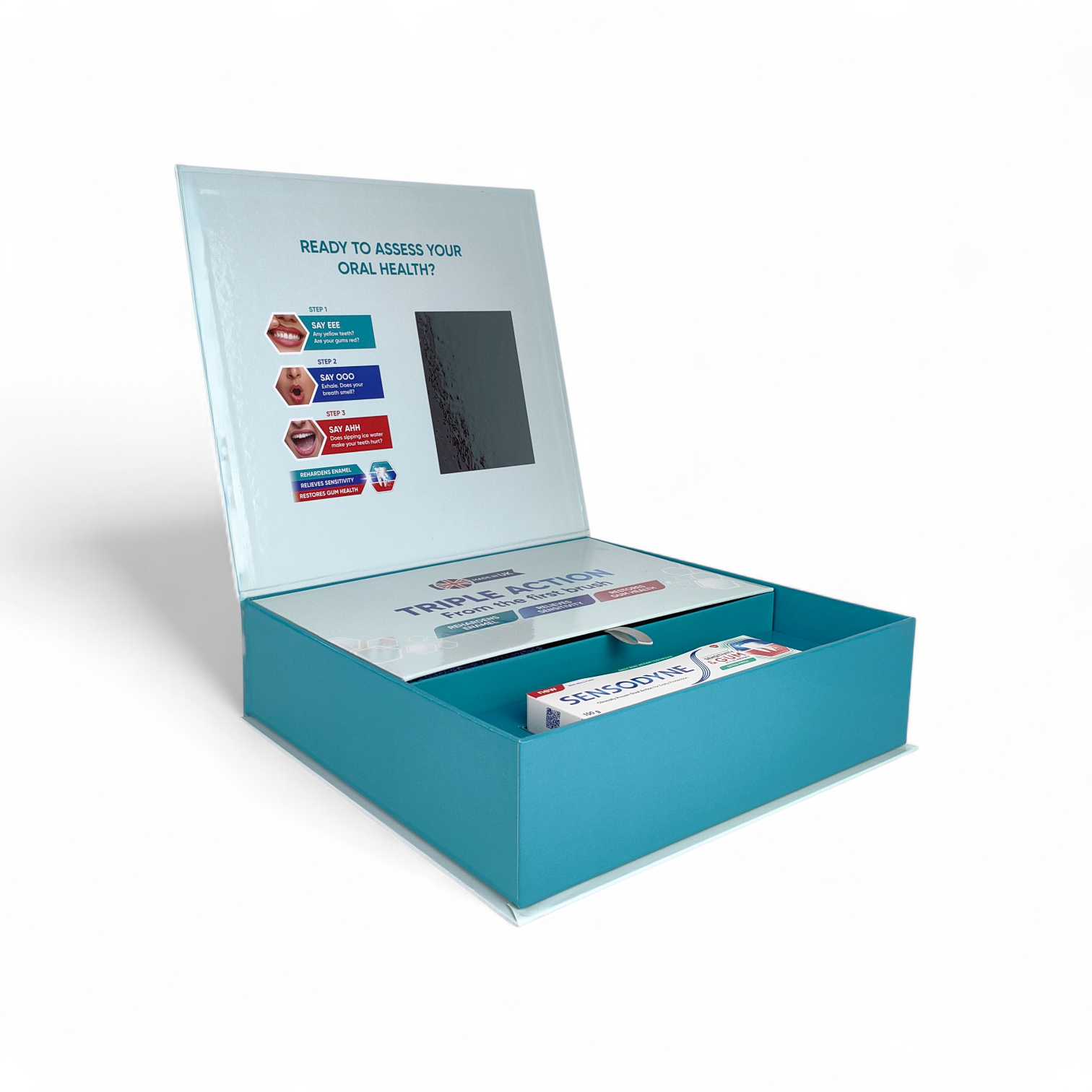 Custom Sensodyne dental care PR kit with precision-cut compartments and a lightweight reflective surface used in place of glass for safe distribution.