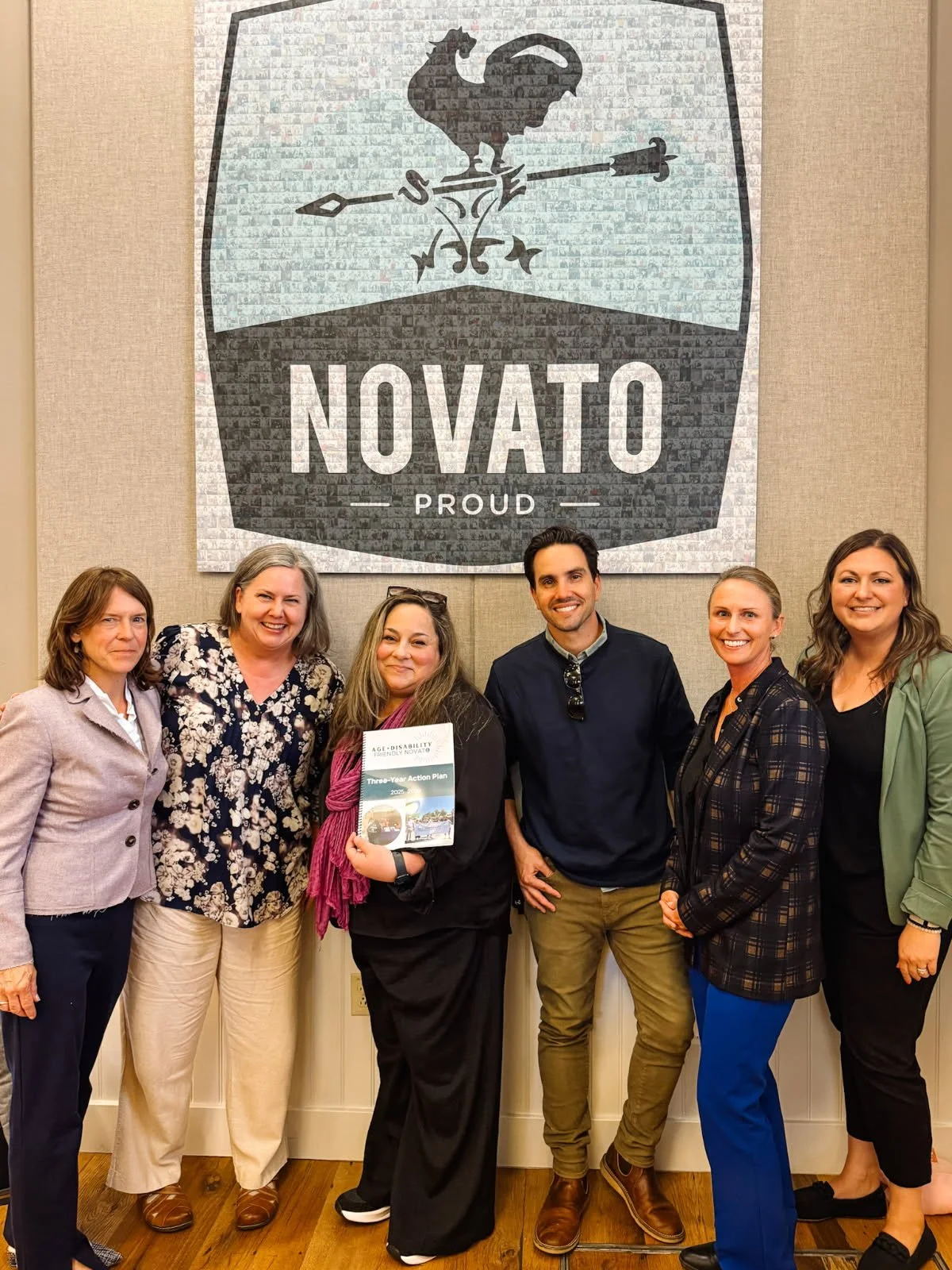 Picture of a group of people in front of a City of Novato sign.