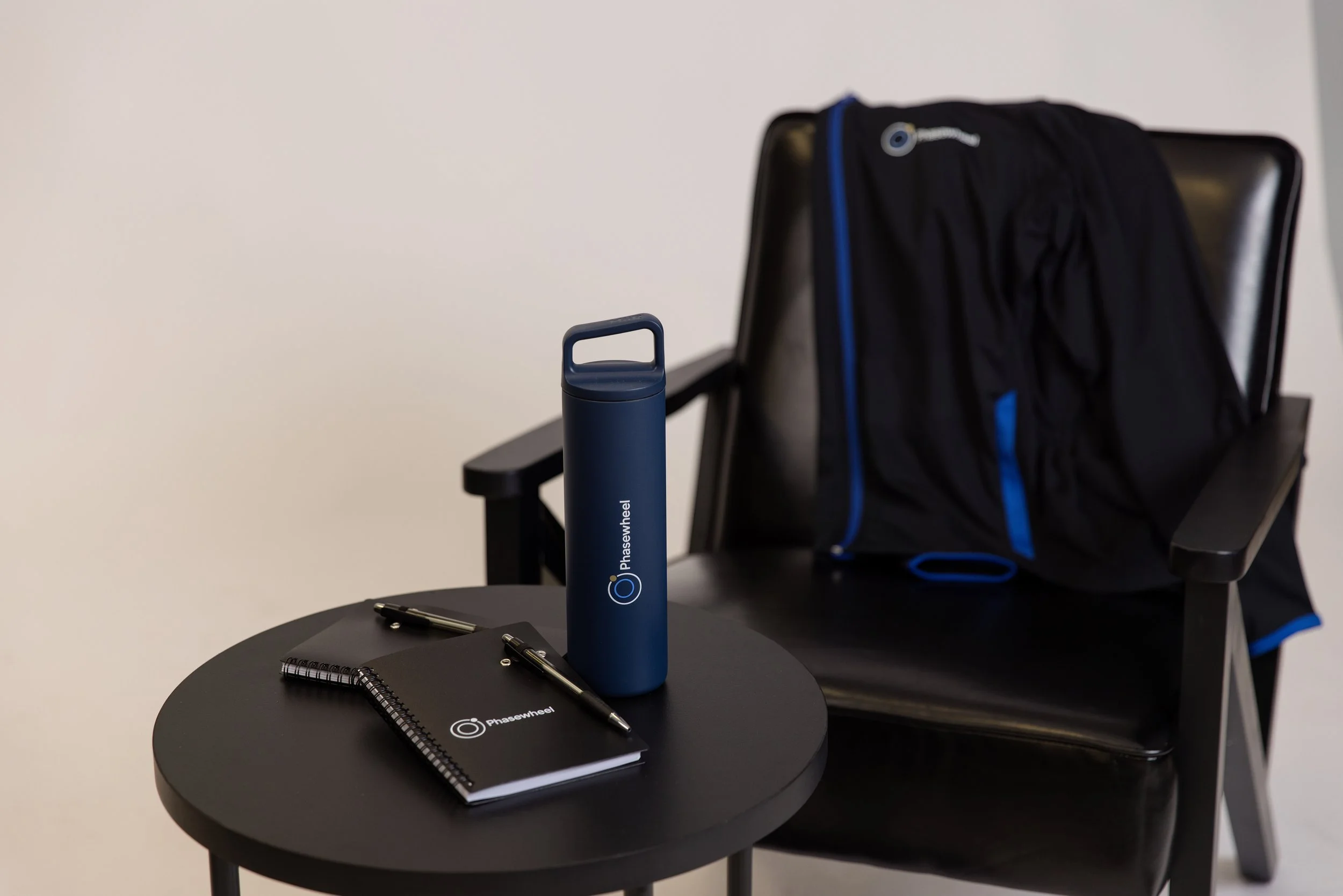 Phasewheel jacket, waterbottle and notebook