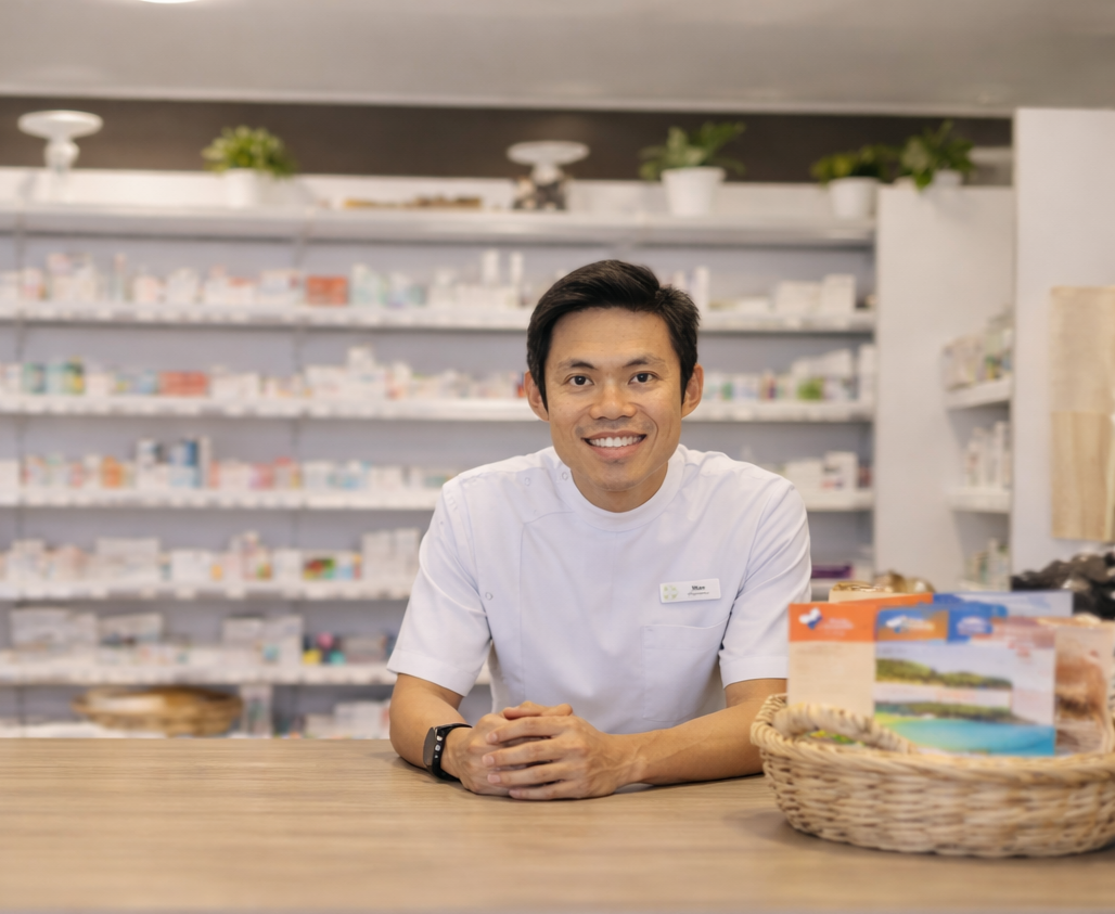 Pharmacist Sim Lee at the counter inside Trigg Medical Pharmacy