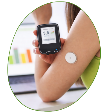Continuous glucose monitor sensor on an upper arm next to a handheld reader