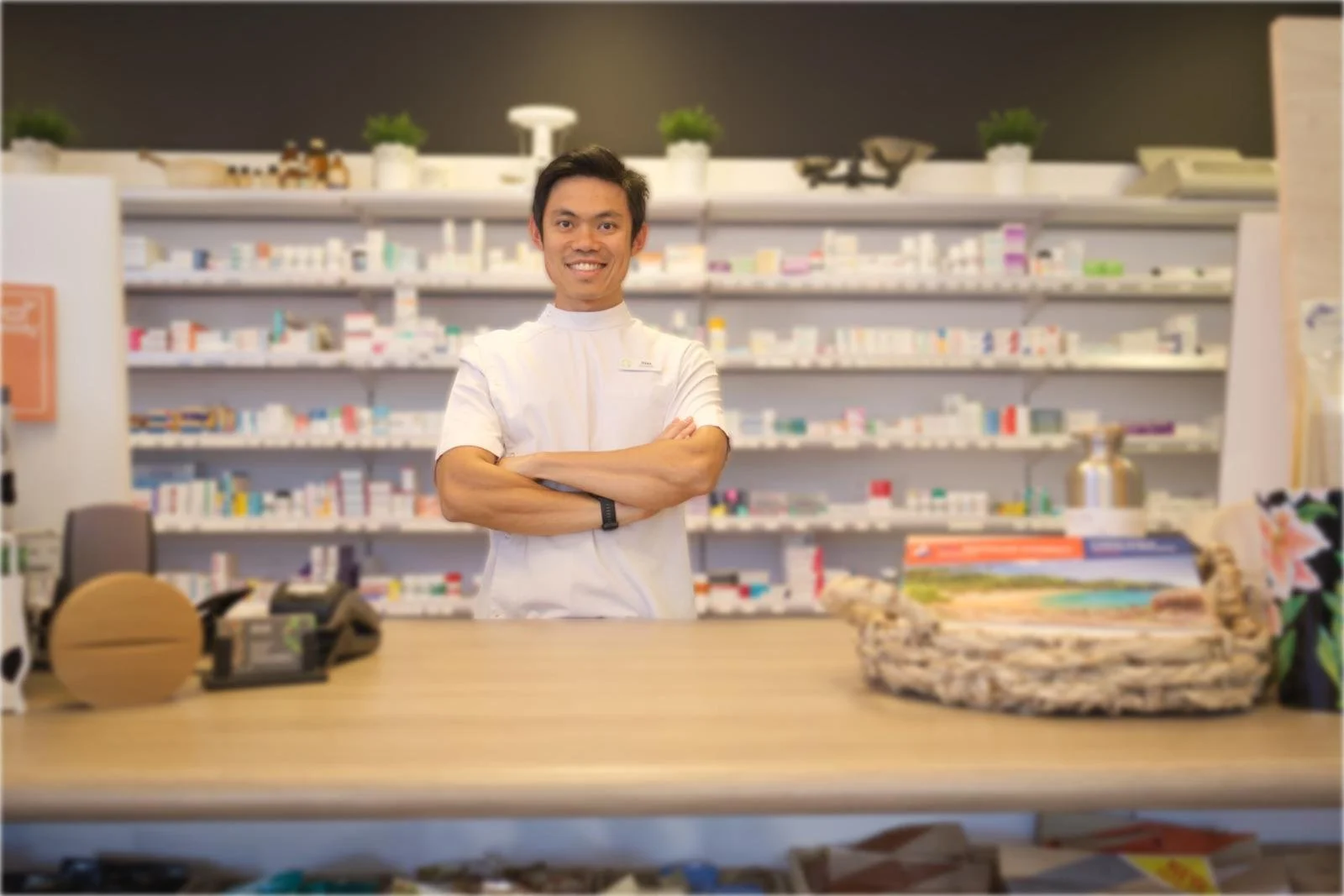 Pharmacist and owner Sim Lee behind the counter at Trigg Medical Pharmacy