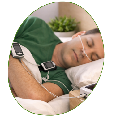 Man asleep in bed wearing a home sleep study monitor