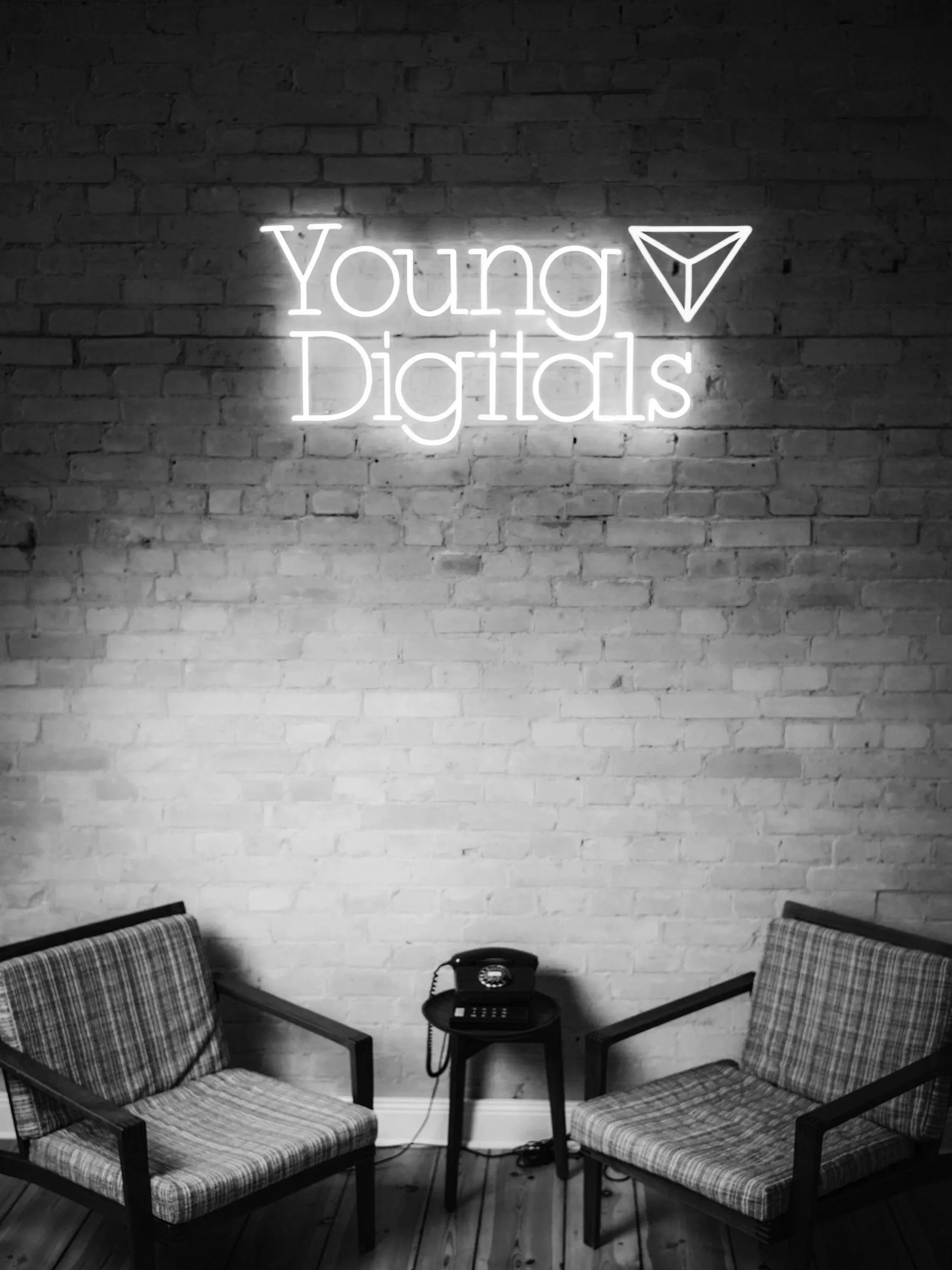 A silver pen resting on a white marble surface.