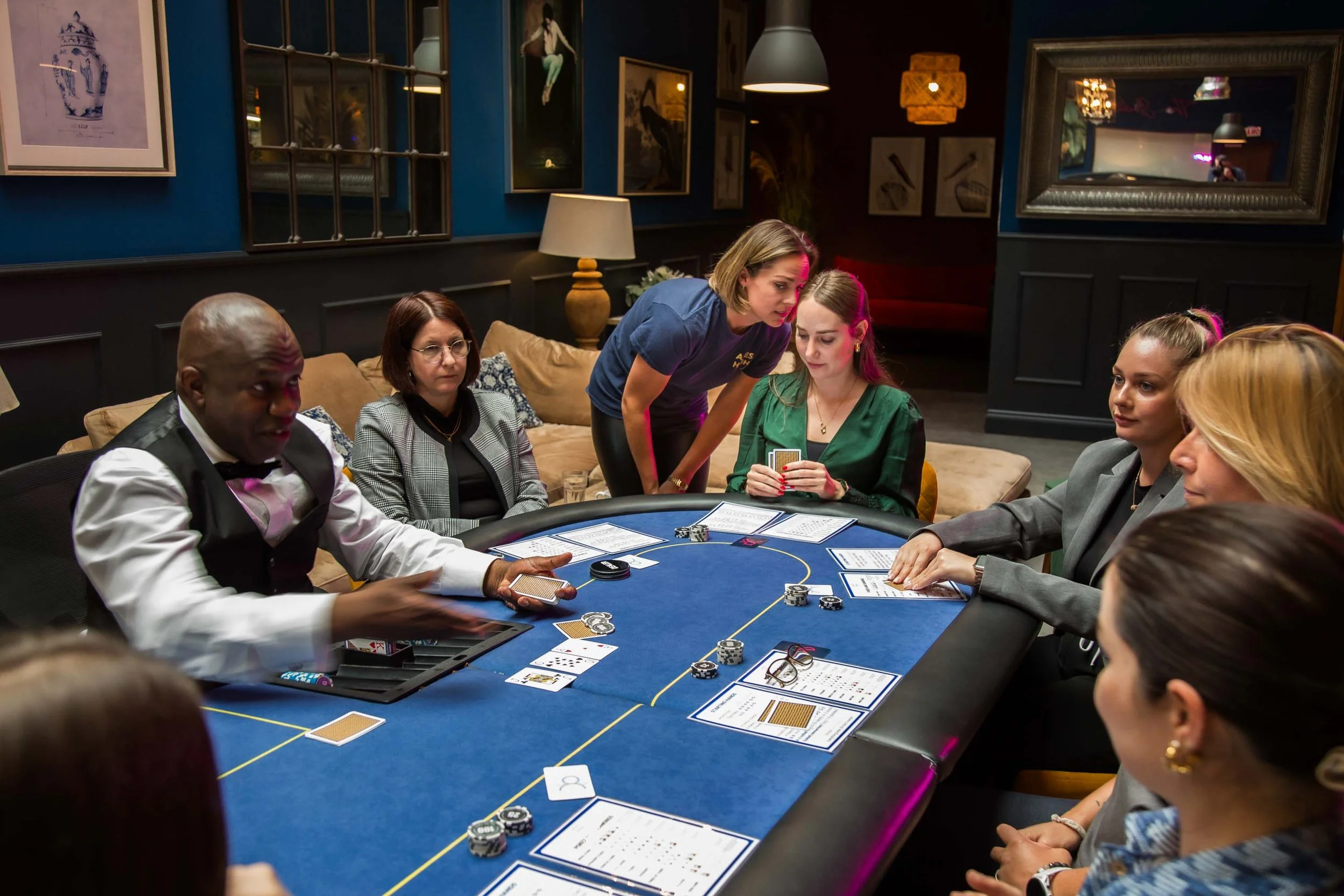 People playing poker with corporate facilitation by Aces High founder, Jo Living, for a corporate skills and negotiation training