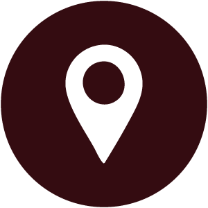 Black location pin icon on a dark background.