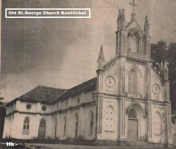 A black and white photo of the Old St. George Church in Koottickal, showing its tall, ornate facade and surrounding buildings.