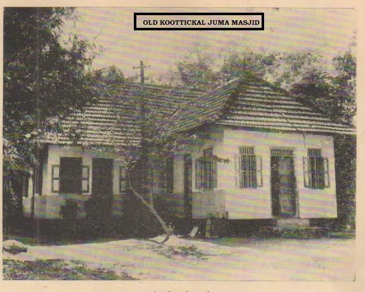 Black and white photo of an old mosque building with a tiled roof, small windows, and an entrance door. Trees surround the structure. Text at the top reads 'OLD KOOTTICKAL JUMA MASJID'.