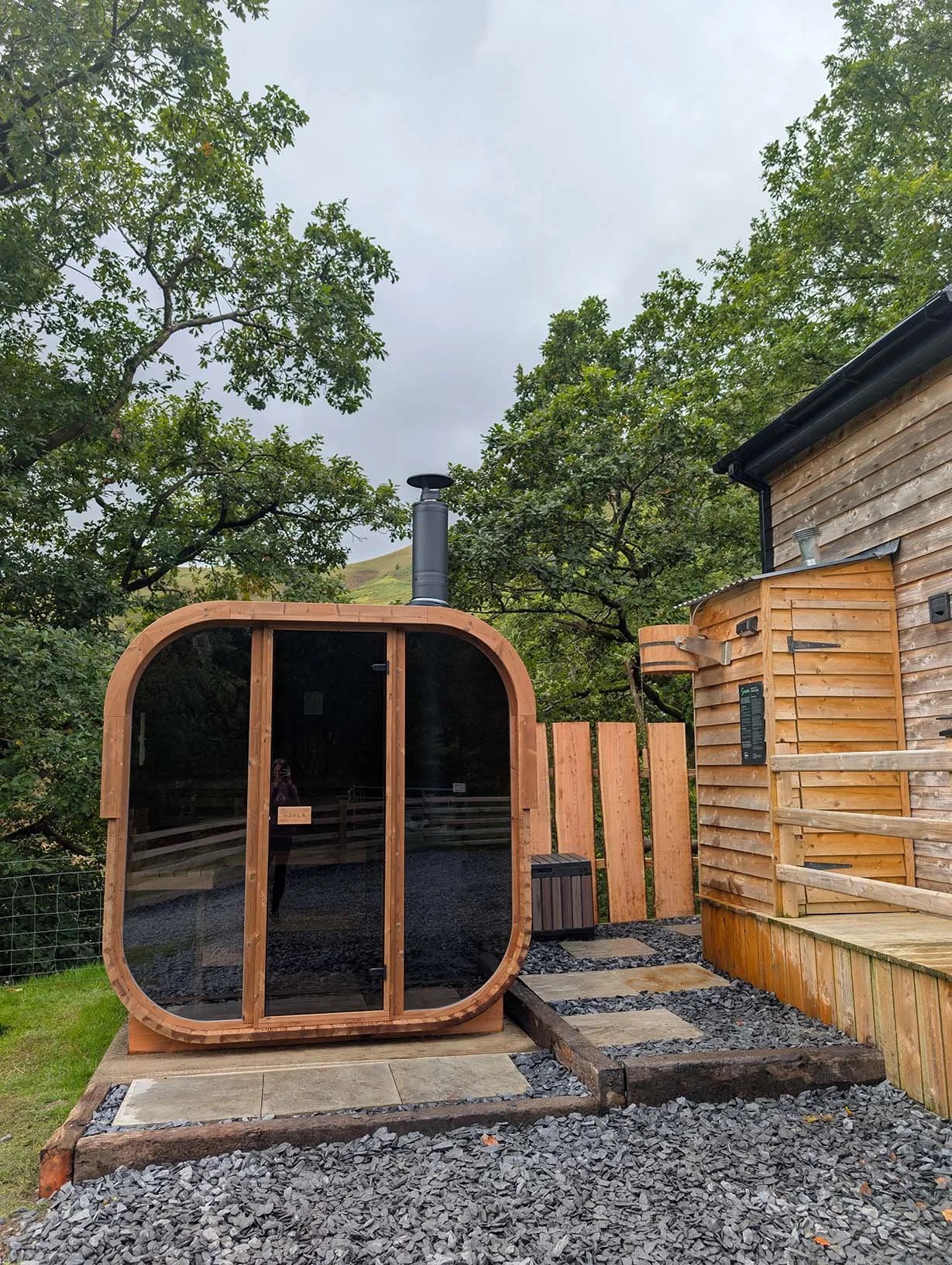 Modern glass fronted outdoor private sauna located next to Nant Cafn cabin. Relax and warm your body with mountain views.