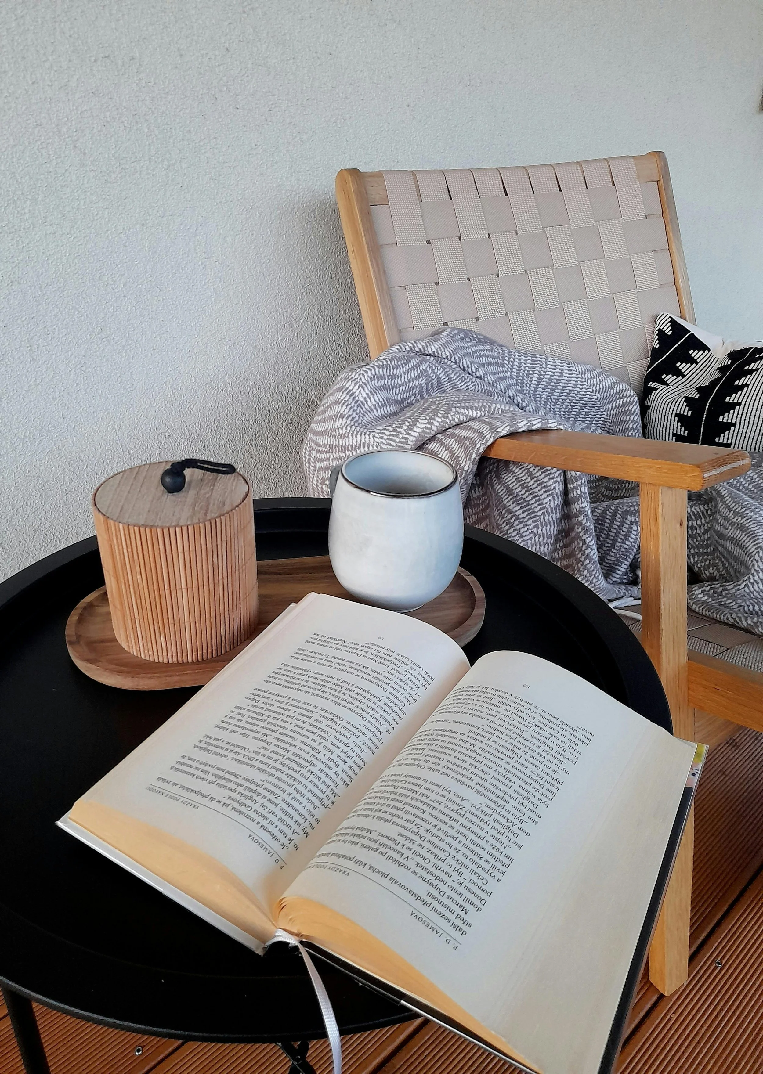 Calm reading space with chair and mug representing mental health support for overwhelmed parents