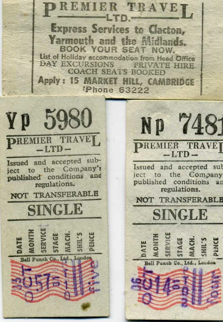Two old train tickets issued by Premier Travel Ltd. for a journey from London to Clacton, Yarmouth, and the Midlands. The tickets are marked non-transferable, issued in London by Bell Punch Co., Ltd. The tickets have red, purple, and blue distribution stamps with dates, and printed details about travel conditions.