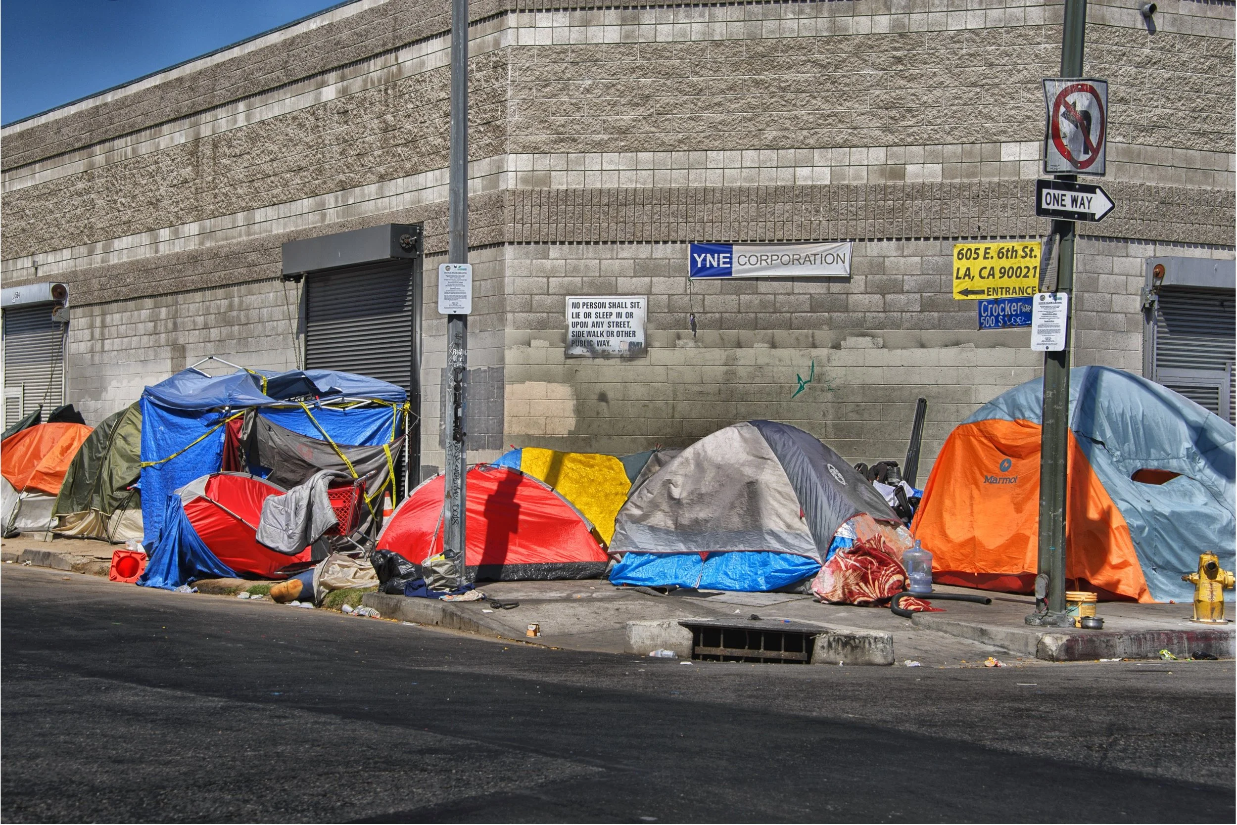 Several colourful tents on a street corner in downtown Los Angeles.