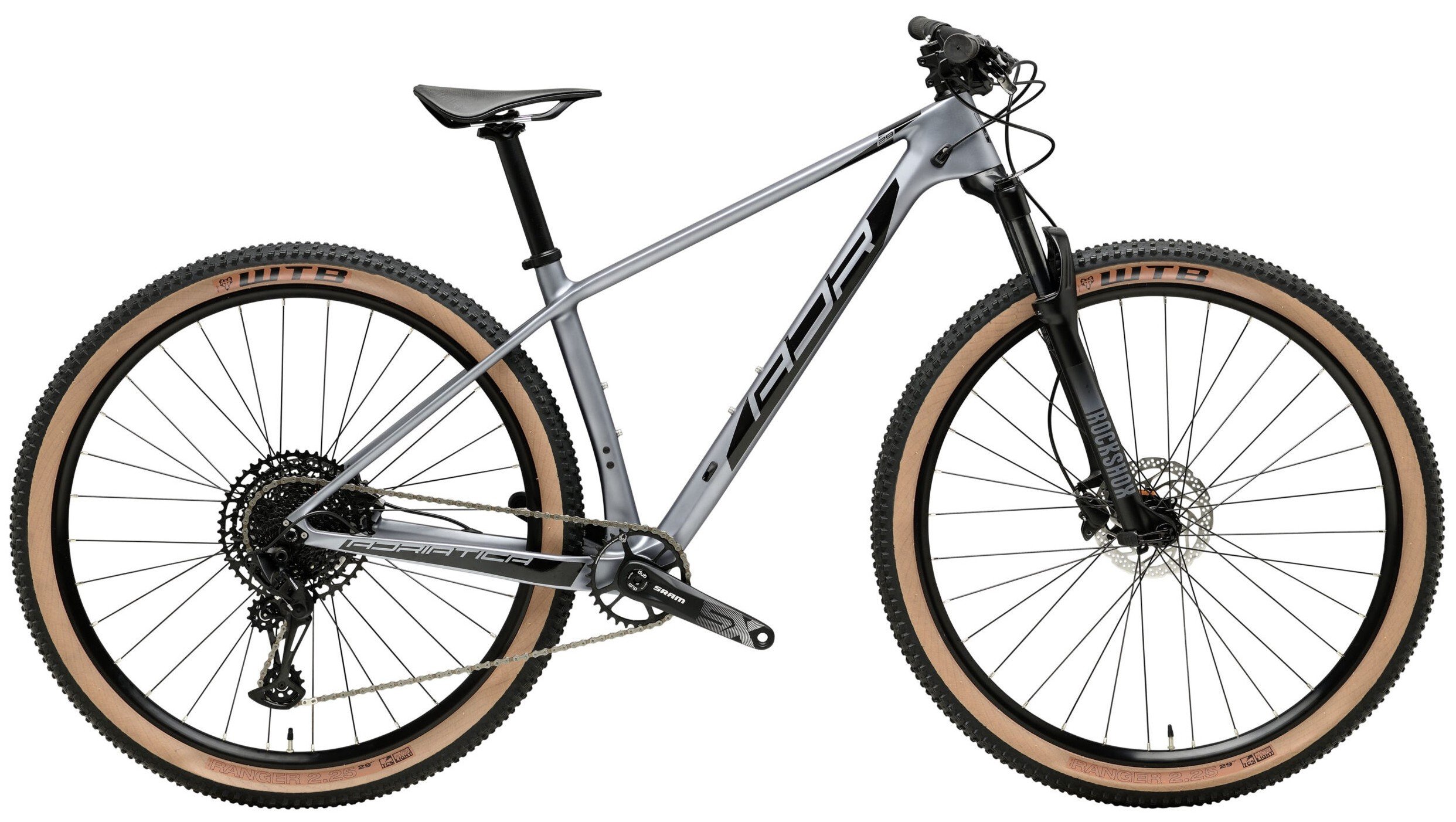 Una mountain bike con telaio grigio e dettagli neri, pneumatici a spalla larga color crema, forcella anteriore nero e manubrio con leve e freni.