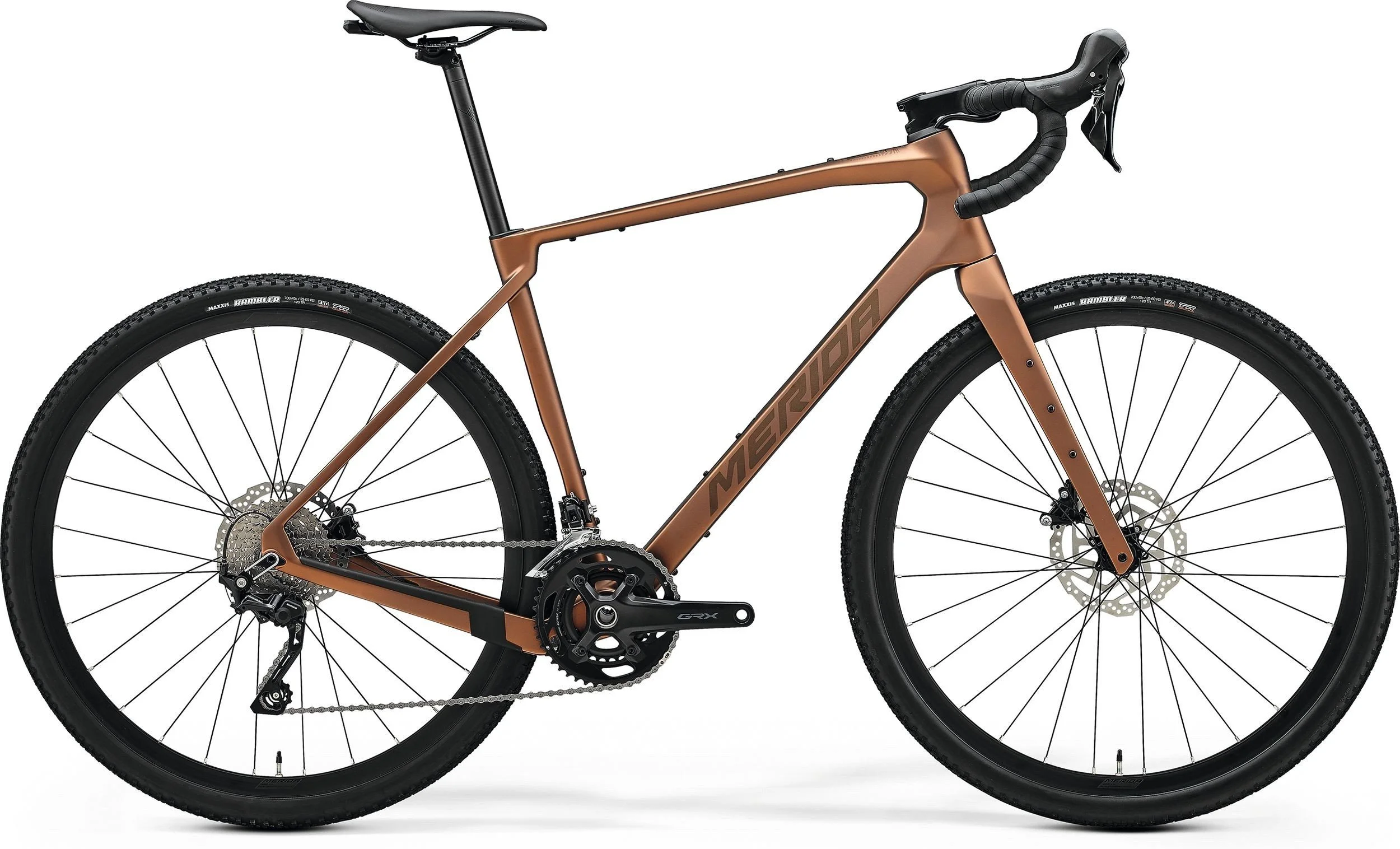 Bici da corsa con telaio marrone, pneumatici con profilo chunky, manubrio curvo, sella nera, e cambio Shimano.