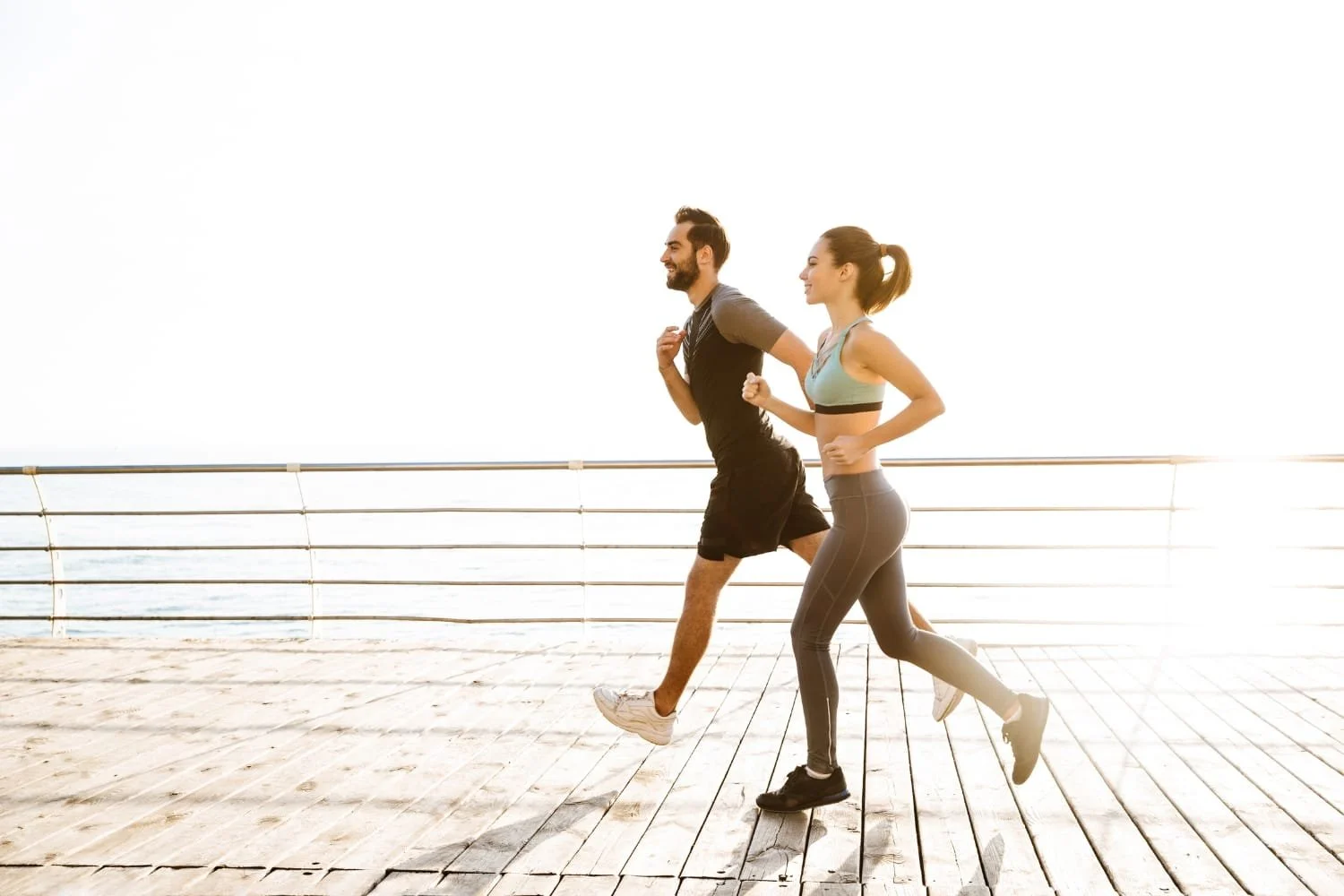 Couple running by the beach