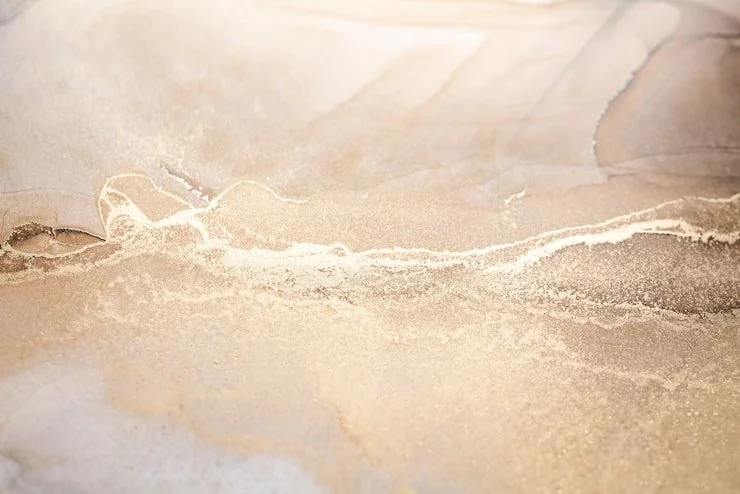 Luxury champagne abstract backdrop with soft beige marble texture, golden shimmer details, and elegant neutral tones for premium event photography.