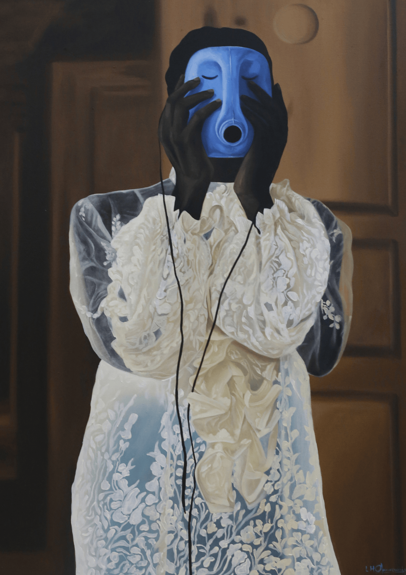 Person in a white embroidered dress is holding a blue theatrical mask with a large hole for the mouth in front of their face, masking their identity.