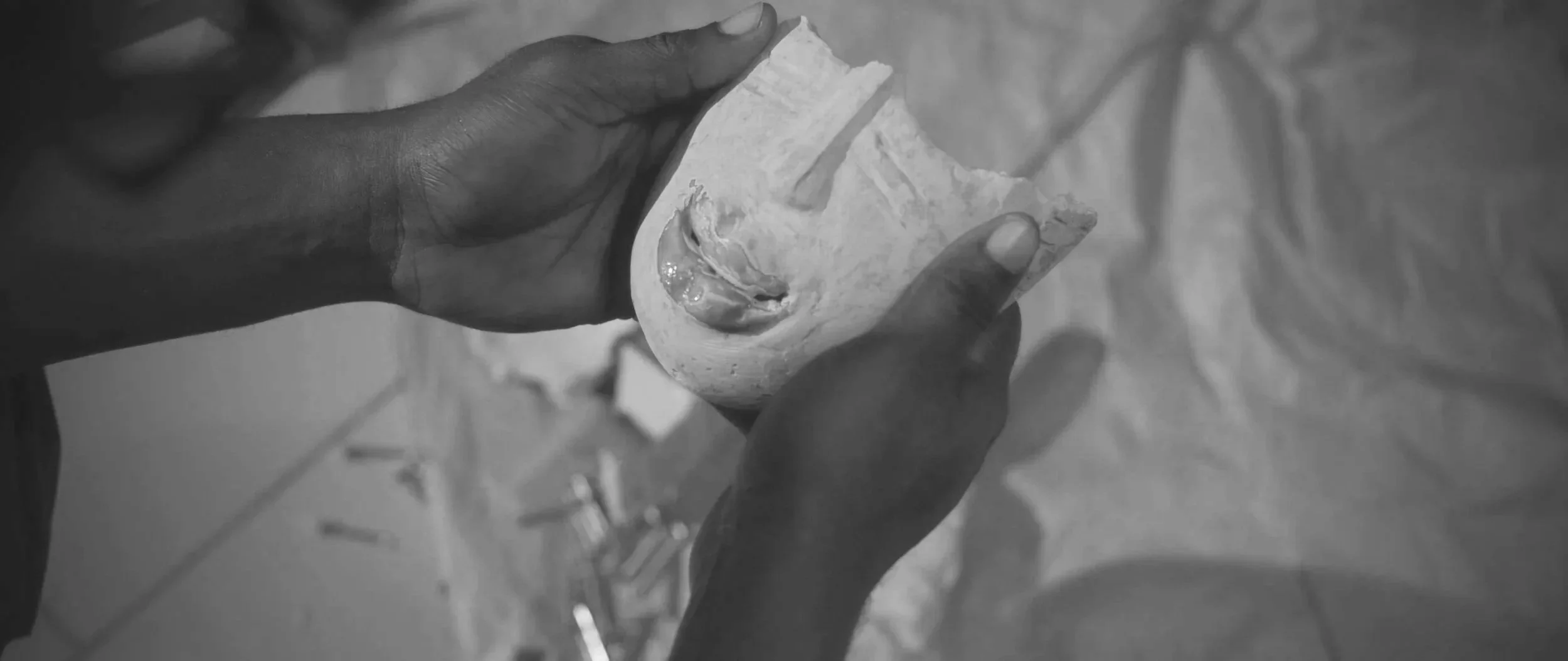 Hands holding a piece of white chalk