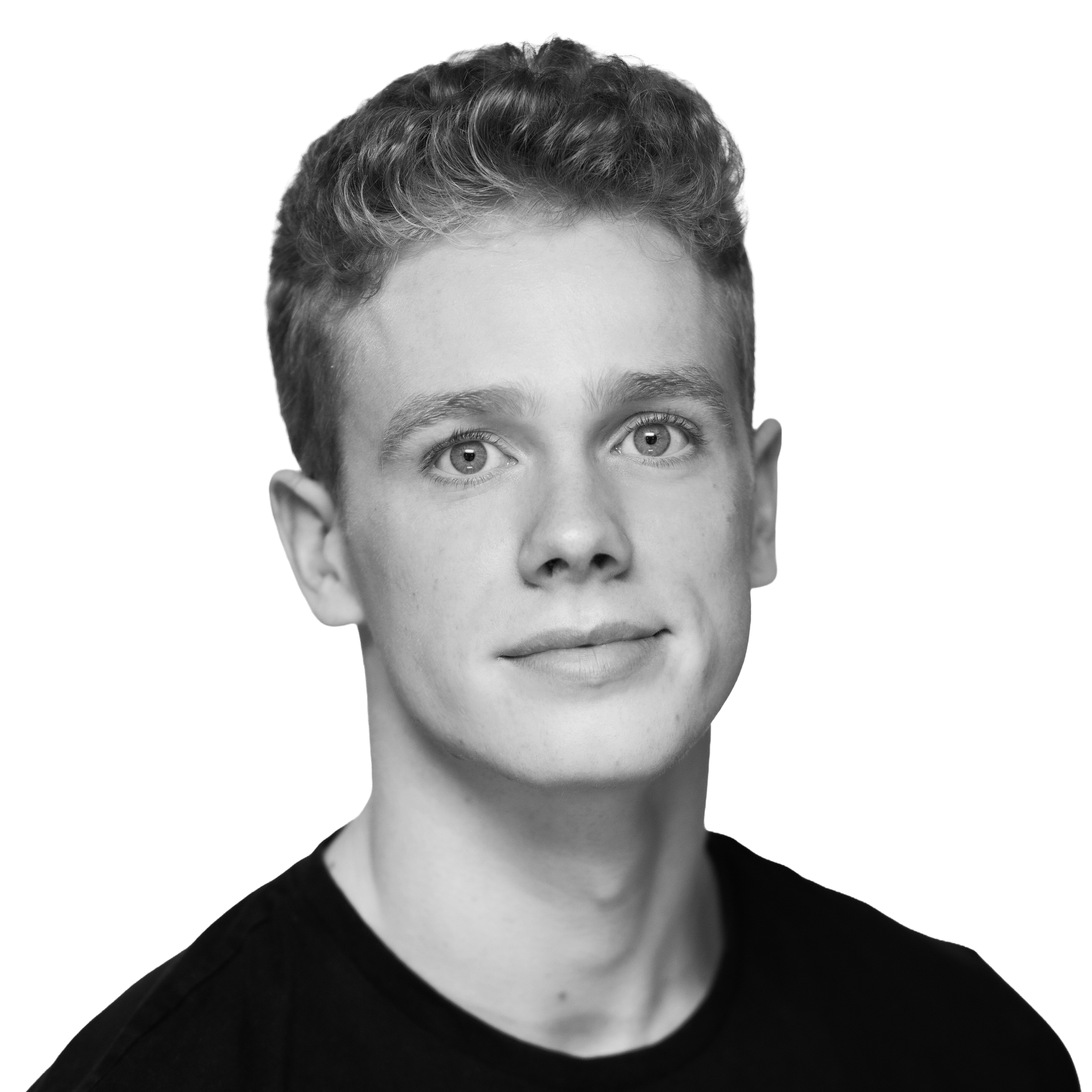 Headshot of a young man with curly hair wearing a black shirt, smiling slightly, against a plain background.