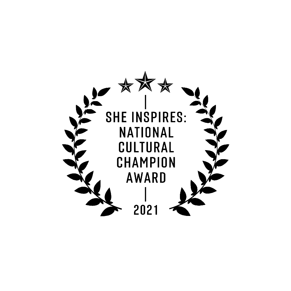 An award decal with stars and laurel wreaths, reading 'She Inspires National Cultural Champion Award 2021'.