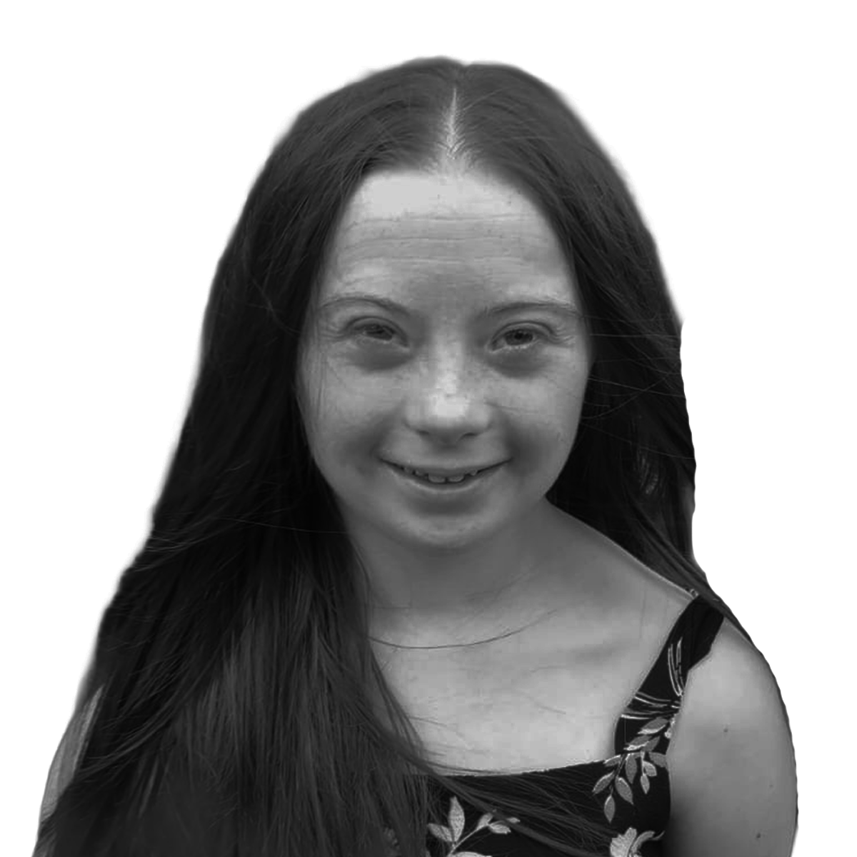 Black and white portrait of a smiling young woman with long hair wearing a floral dress.